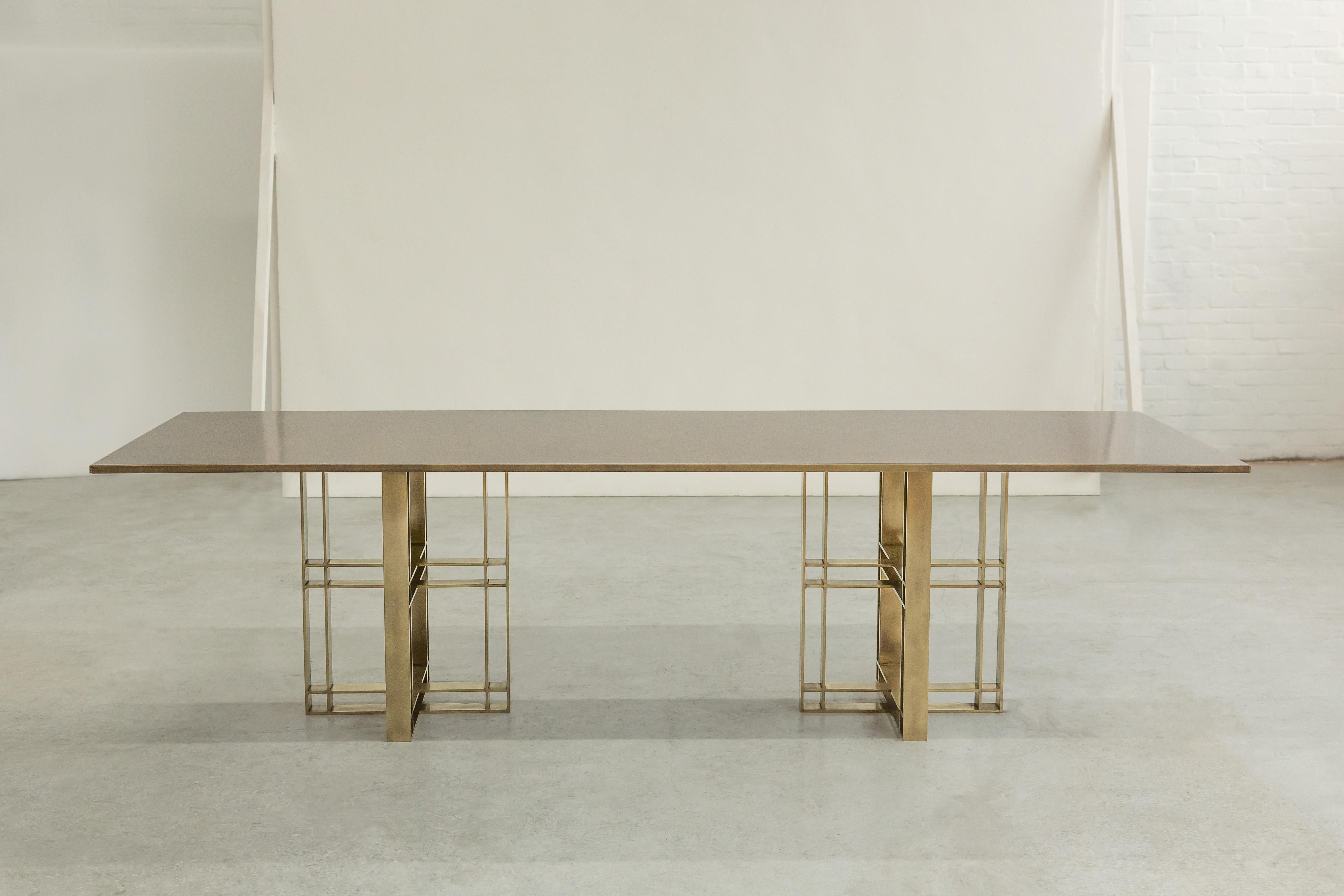 A dining table in patinated brass. Handcrafted in the North to order. Custom sizes and finishes are available.

Measures: 290cm (width) x 75cm (height) x 95cm (depth).
Custom sizes available. Available with marble or timber top.

Made to order in 12