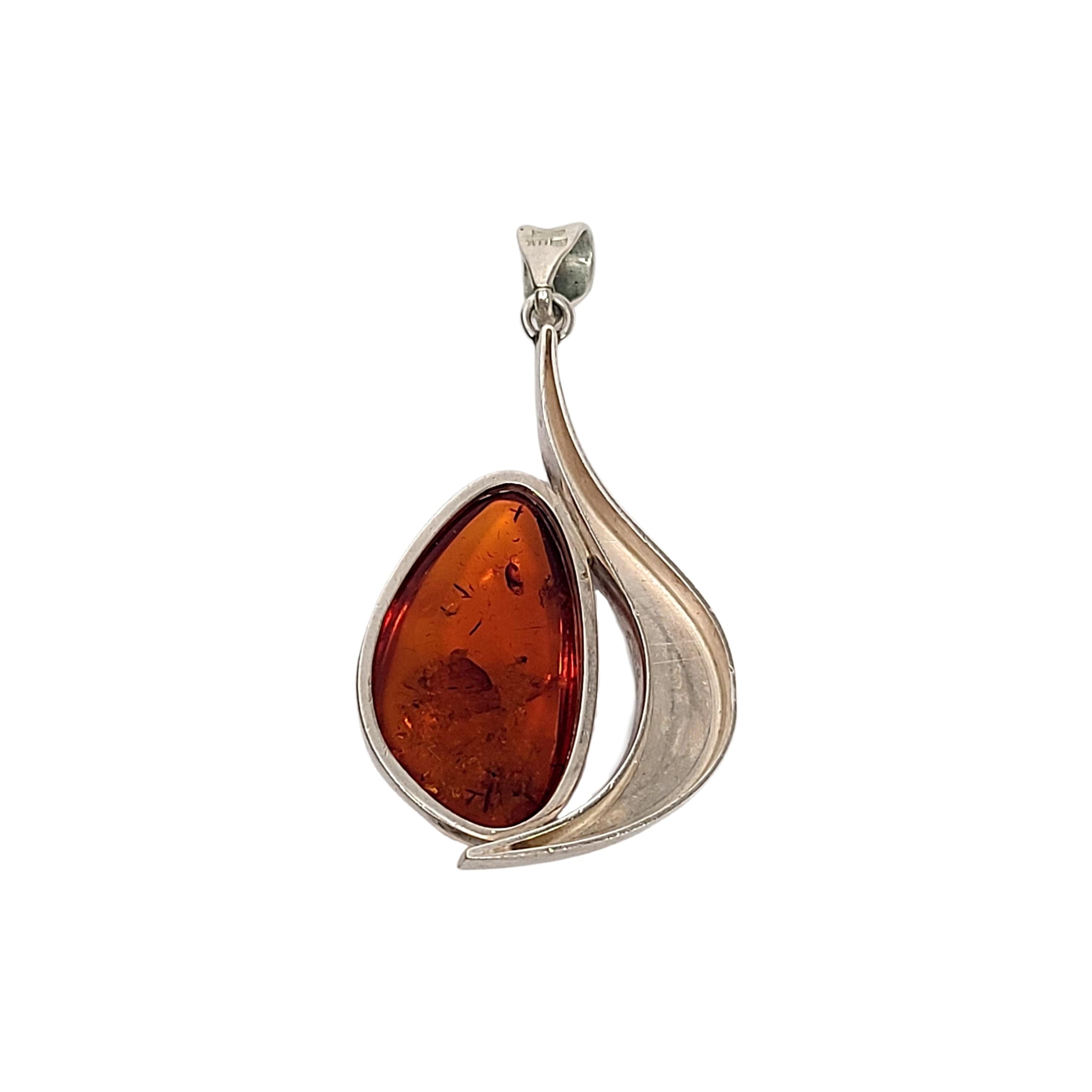 Sterling silver amber pendan by ATI Poland.

Large amber stone set in a modernist design pendant by designer ATI of Poland.

Measures approx 2 1/2