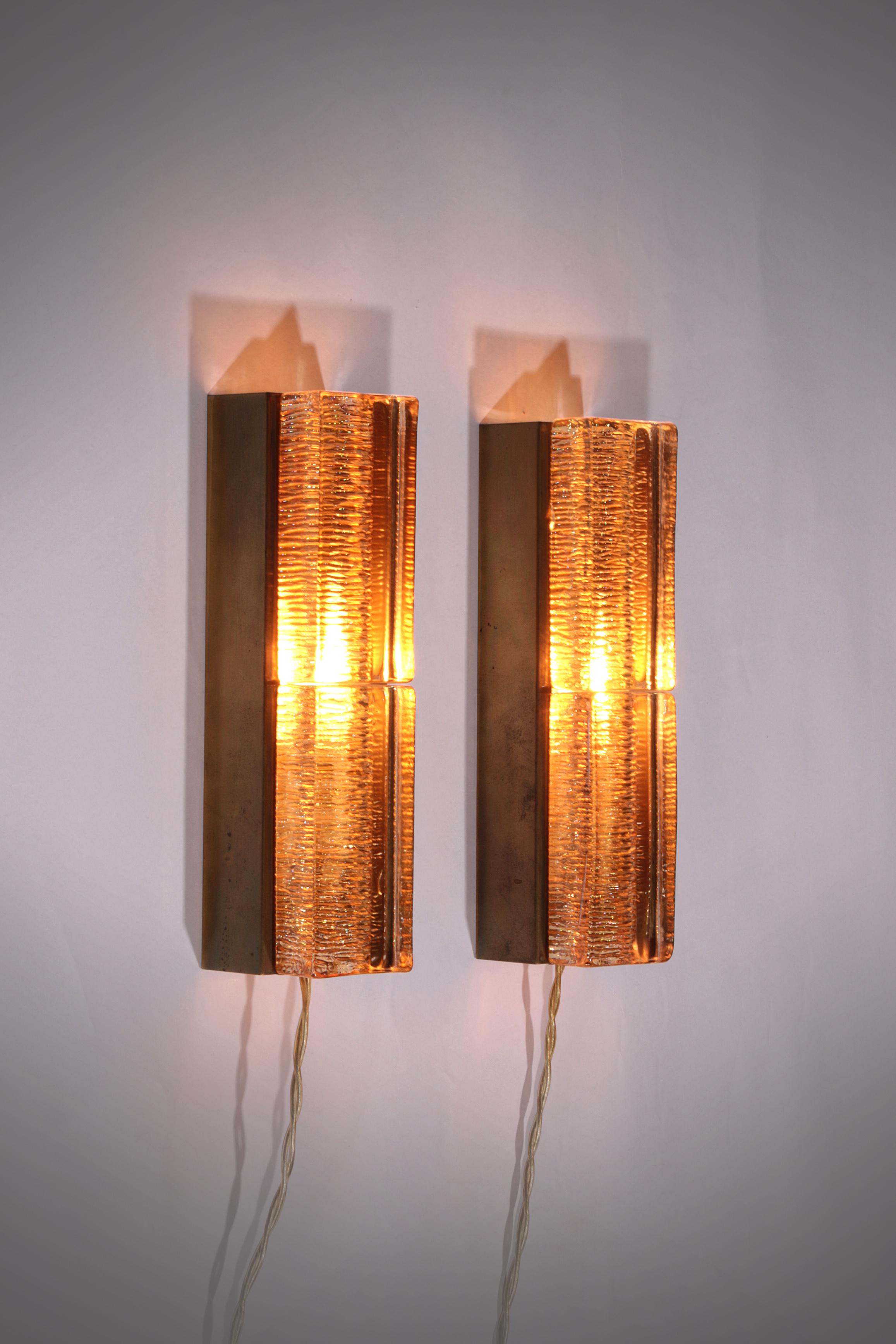 

Step into timeless elegance with this set of two original Atlantic wall lamps designed and produced by the renowned Danish lighting manufacturer Vitrika in the 1970s. These lamps are a true representation of Scandinavian design excellence,