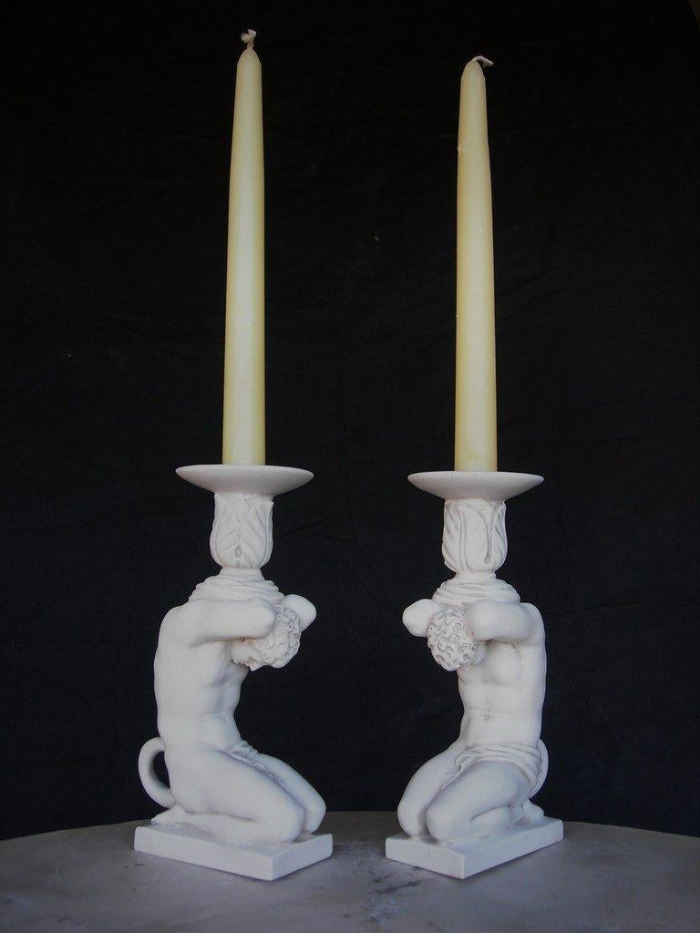 A pair Atlas candleholder marble sculptures, 20th century. 
A Grand Tour souvenir

This is a fantastic sculpture of Atlas supporting an acanthus candle holder, made to grace the finest of interiors.

  