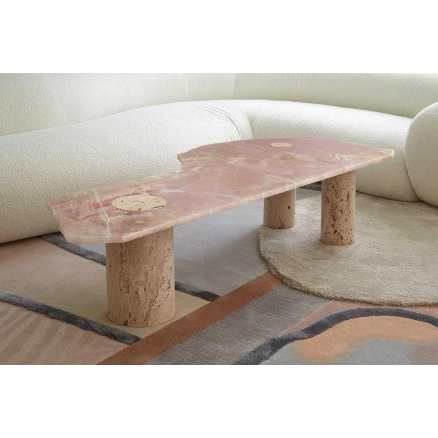 Atlas Coffee Table by Patricia Bustos de la Torre
Dimensions: D 68 x W 166 x H 40 cm.
Materials: Polish onyx and Navona travertine marble.

The Atlas Coffee table has been baptized after its resemblance with a map,
showcasing irregular edges and an