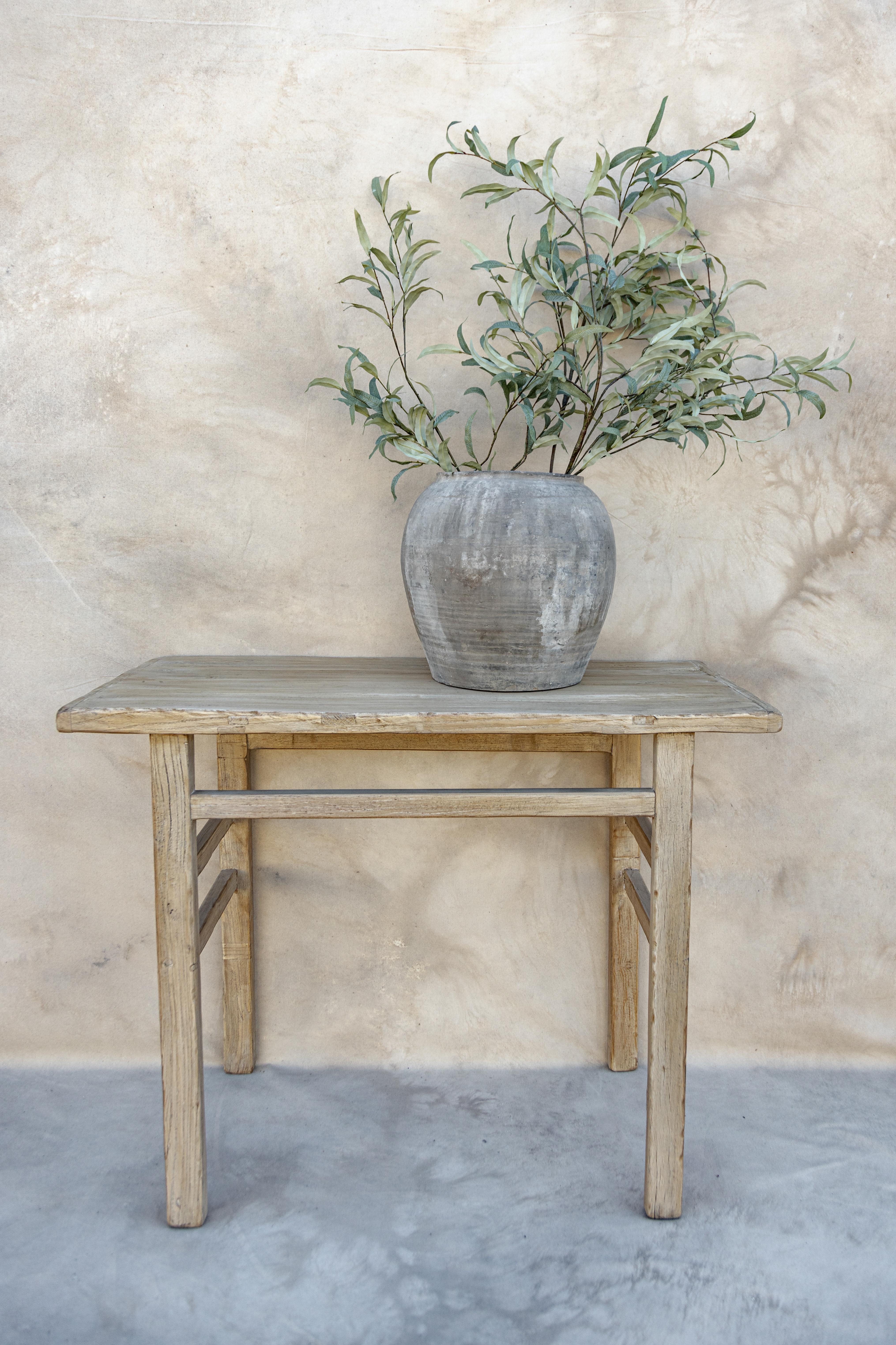Introducing our Atlas console table. Crafted from vintage elm wood sourced throughout Europe and Asia. We love the minimalist, rustic design, and more narrow profile, perfect for the end of a hallway or smaller entryway. This piece is perfectly