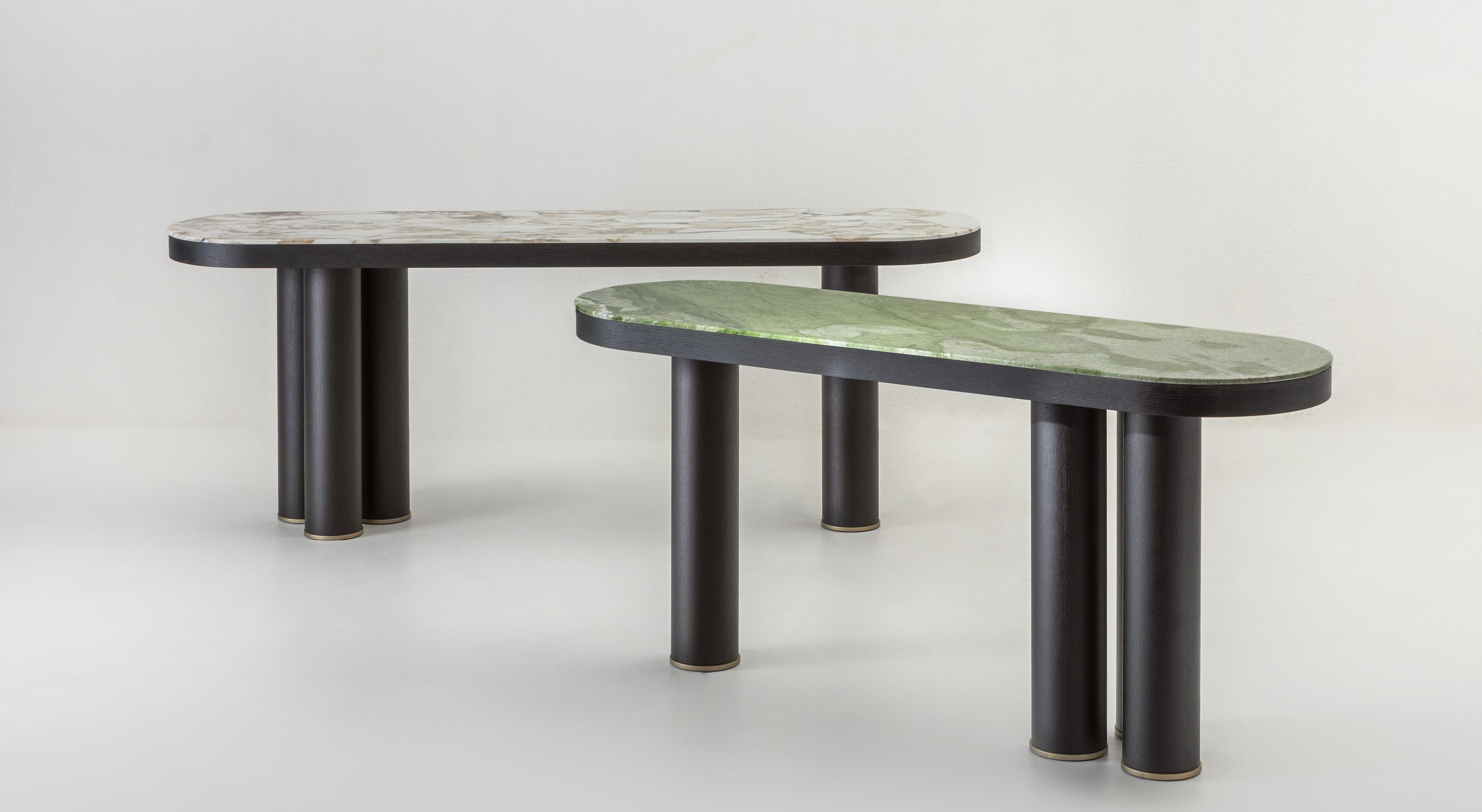 Atlas is a collection of consoles featuring an architectural design with a distinctive asymmetrical base. The base consists of three pillars on one side and a single pillar on the other. The console's essential shape is beautifully complemented by