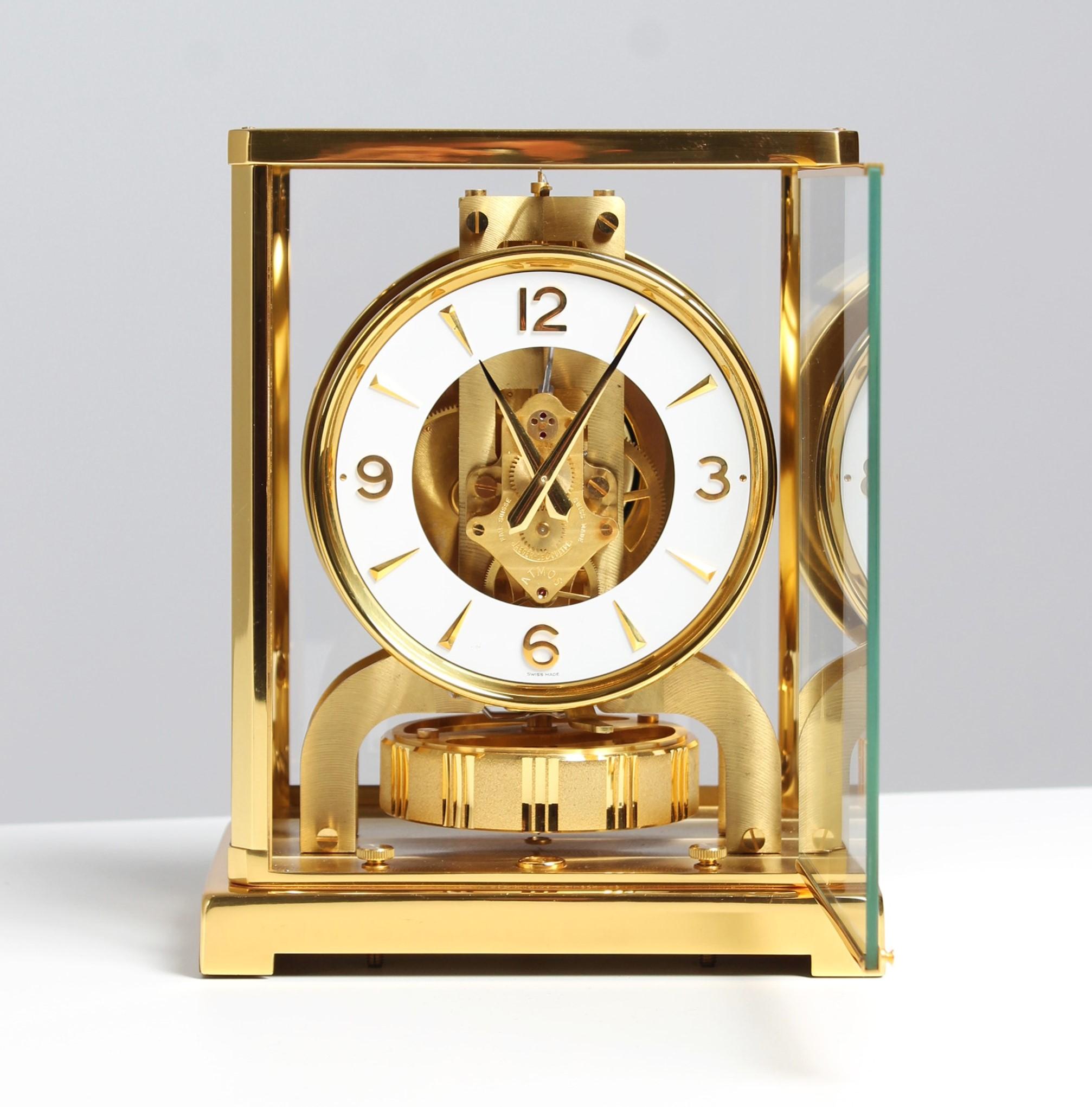 Jaeger LeCoultre - Atmos clock

Switzerland
Brass gold plated
Year of manufacture 1973

Dimensions: H x W x D: 22 x 18 x 13,5 cm

Description:
Atmos V caliber 526 in gold plated brass case.
Classic white dial ring with Arabic