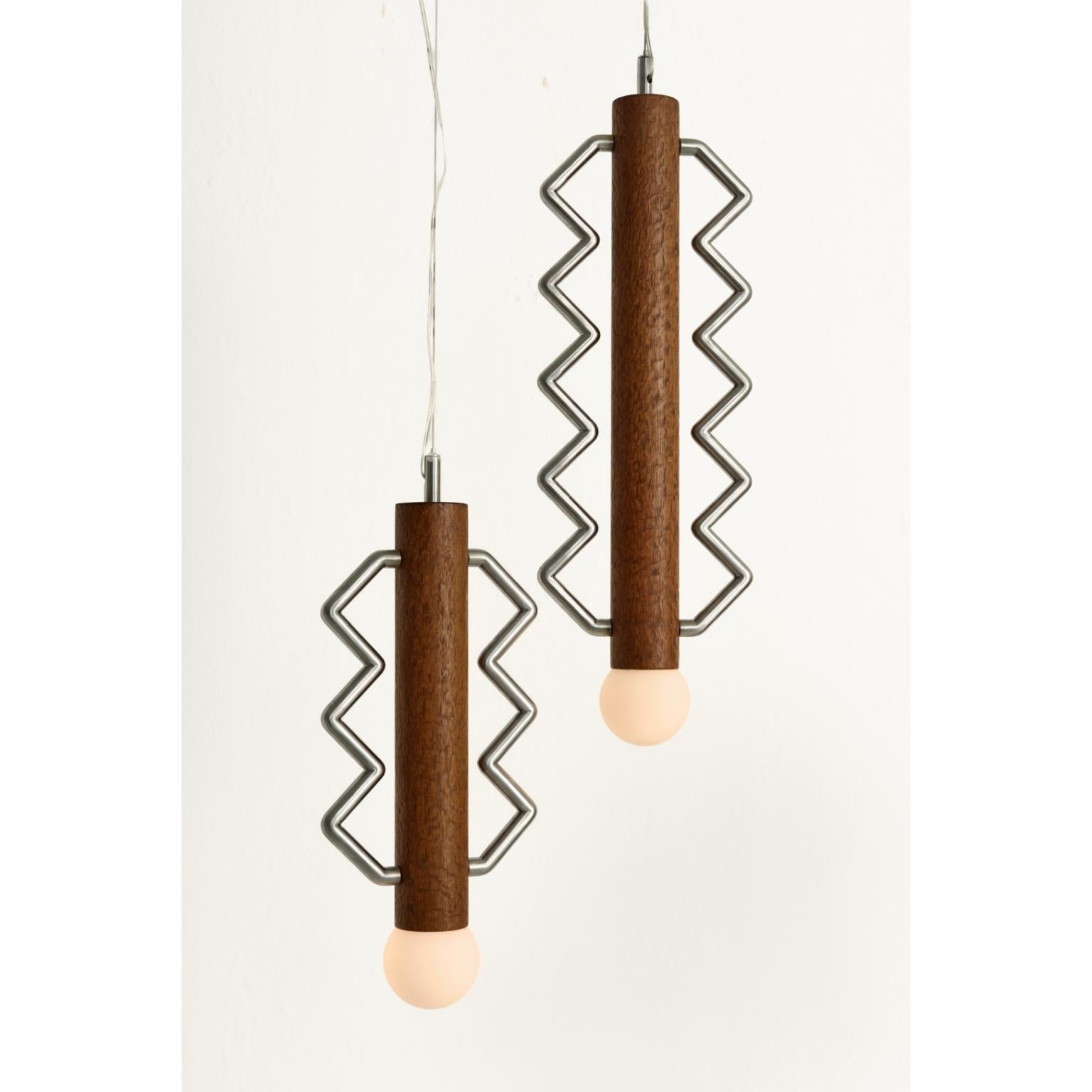 Globe Lighting Lot de 2 lampes à suspension 60/45 par Studio Lugo
Dimensions : L 60-45 x D&H 8 x H 18,6 cm
MATERIAL : Placage de bois de laque, acier inoxydable, crin de cheval.
Finition : vernis mat.
Poids : 3 kg.

Toutes nos lampes peuvent être