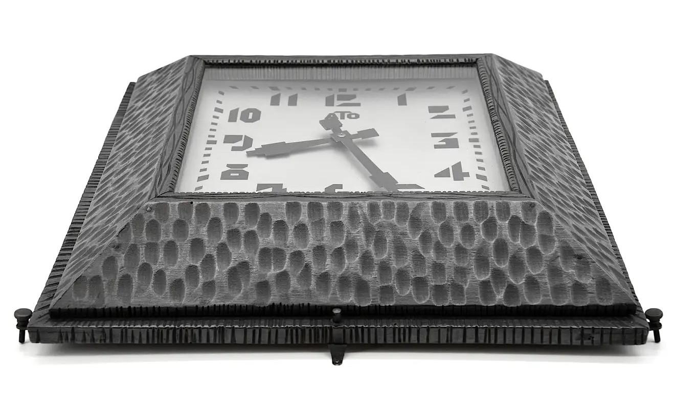 French Art Deco wall clock by ATO (Paris), France, circa 1930. Wood and metal. The frame is made in wood and imitates the metal. Original external adjustment screws. Measures: Height 16.5