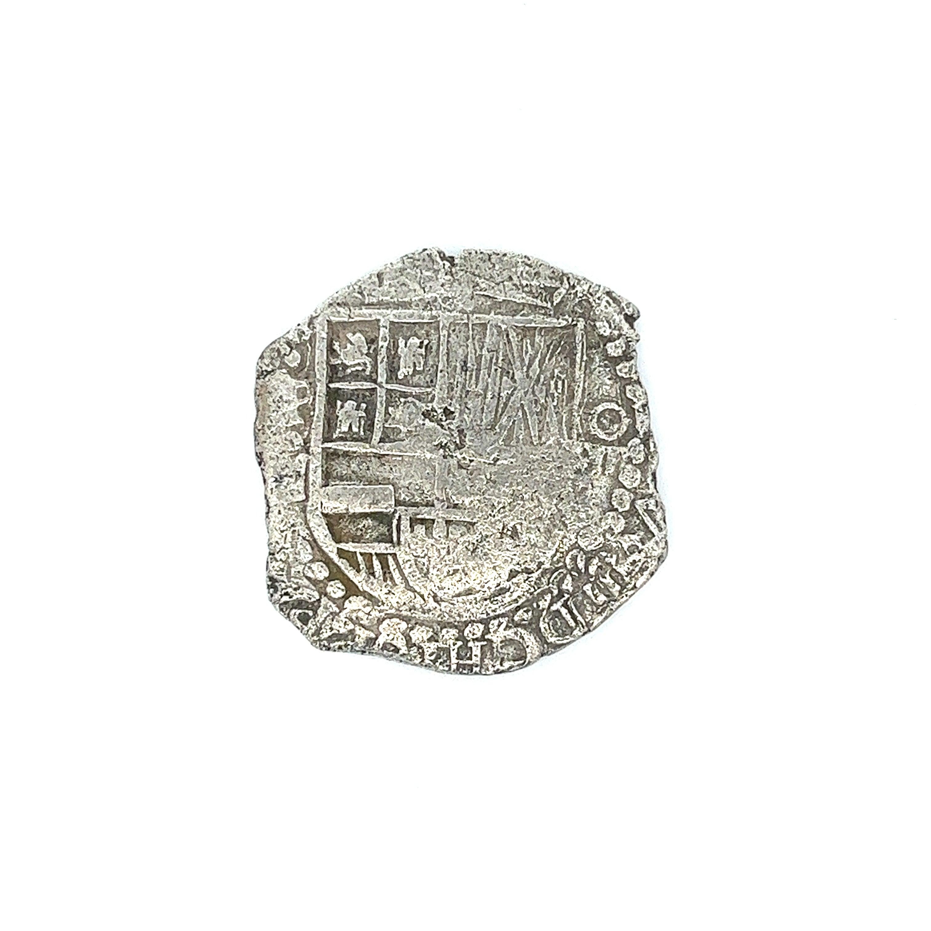 Original Atocha Shipwreck Münze unmontiert komplett mit dem Original-Zertifikat von Treasure Salvors INC. Signiert von Mel Fisher. 

Stufe 1 bedeutet, dass die Münze fast in der Mitte des Trümmerhaufens mit minimaler Korrosion geborgen wurde.

Eine