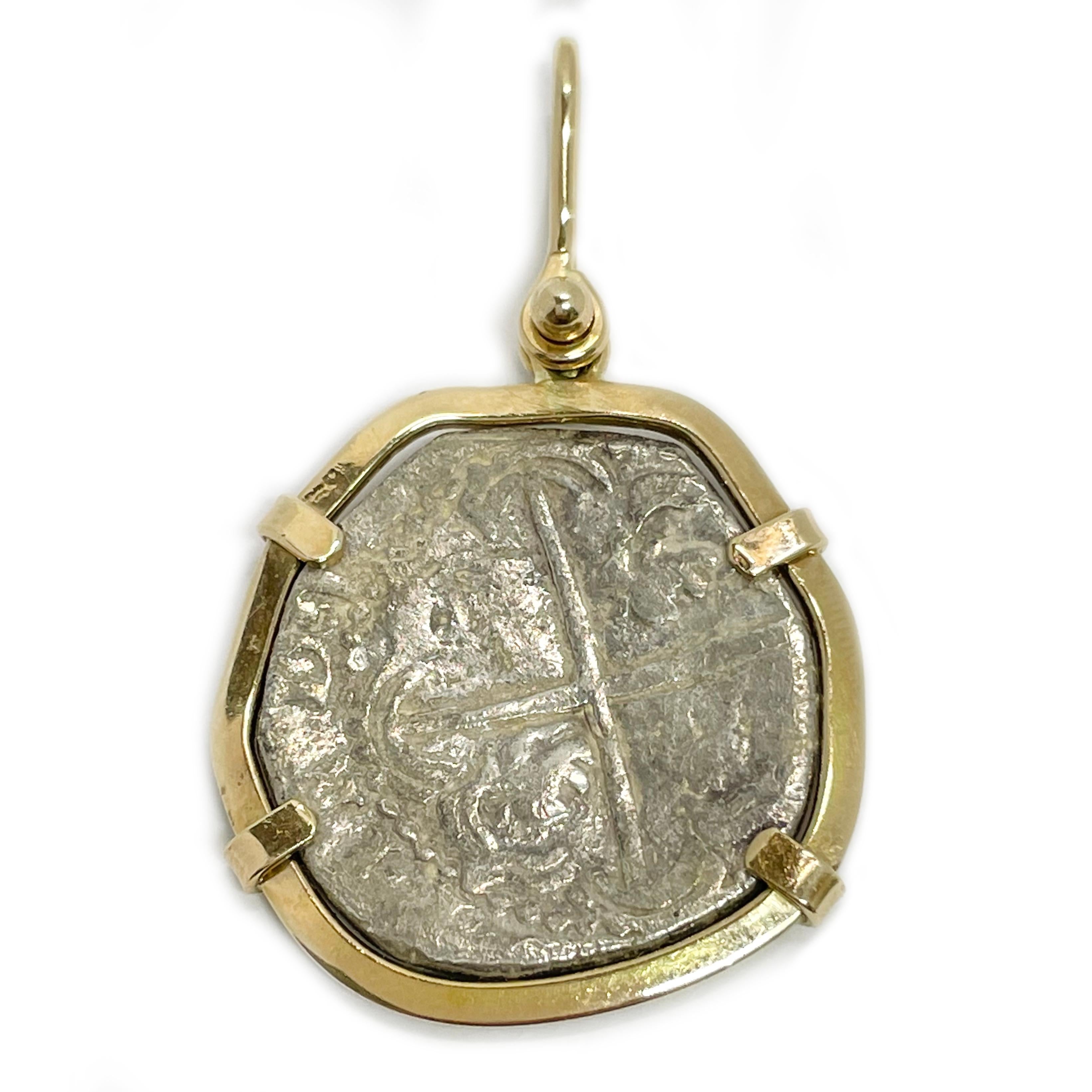 Atocha Two Tone Coin Pendant. The pendant measures 28mm x 43mm (including bail). The coin shows quite a bit of wear, the markings on the coin are not readable and there are no markings on the bezel or coin. The bezel tests as 14 karat yellow gold