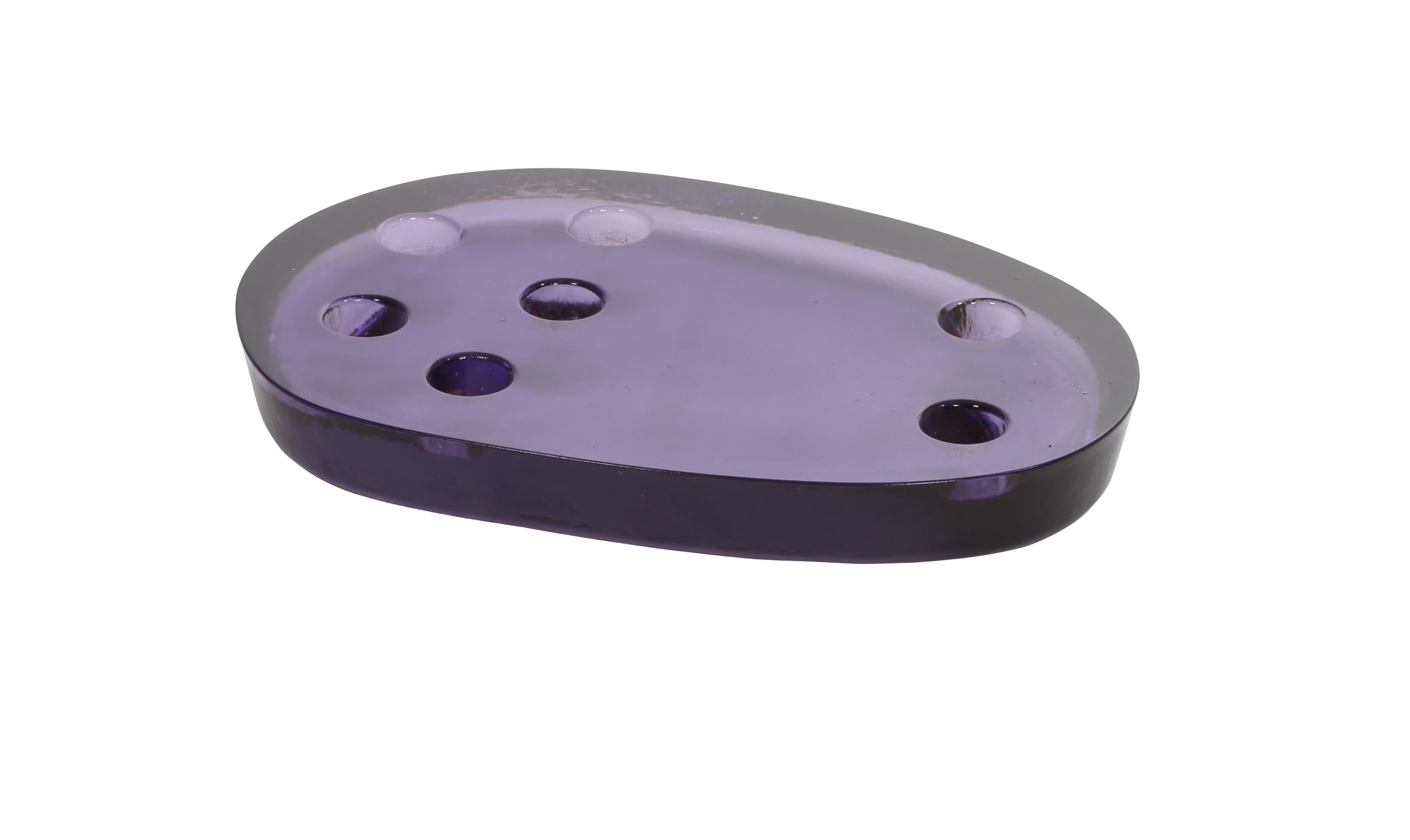 Atoll Big Amethyst candle holder by Pulpo
Dimensions: D32 x W22 x H4 cm
Materials: casted glass

Also available in different colors. 

These simple forms refer to the free-form nature of volcanic islands – much like the changing of glass from