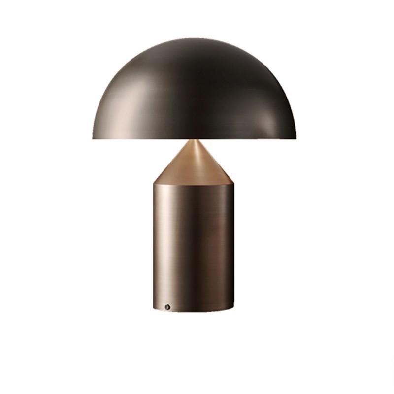 Model 233 table lamp by Vico Magistretti. The iconic Atollo table lamp was originally designed by Vico Magistretti for Oluce in 1977. This is a current production manufactured in Italy. Oluce's newest offering comes in a satin bronze plated finish.