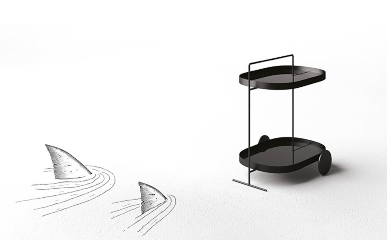 Made in Italy.
Designer: Filippo Mambretti

An elegant service tables / coffee table on wheels in metal, embossed finishing in anthracite color, mirrored fumé shelves with edge.
Antitracking and anti-noise wheels in black nylon.

