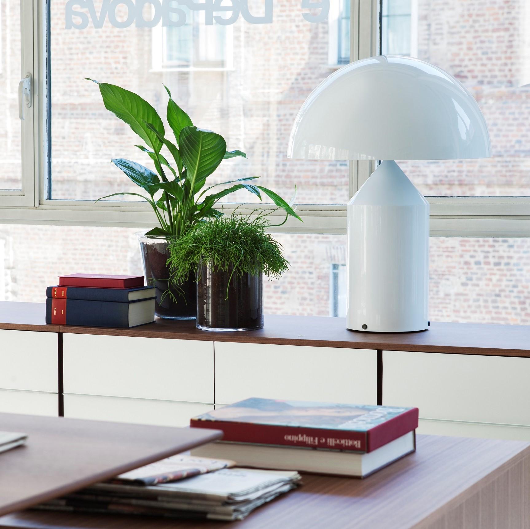 Atollo Metal Table Lamp by Vico Magistretti for Oluce. The Atollo lamp has become an iconic representation of the table lamp. The simple cylinder, cone, and hemisphere combine in such a simple but strong way highlighting form follows function. The