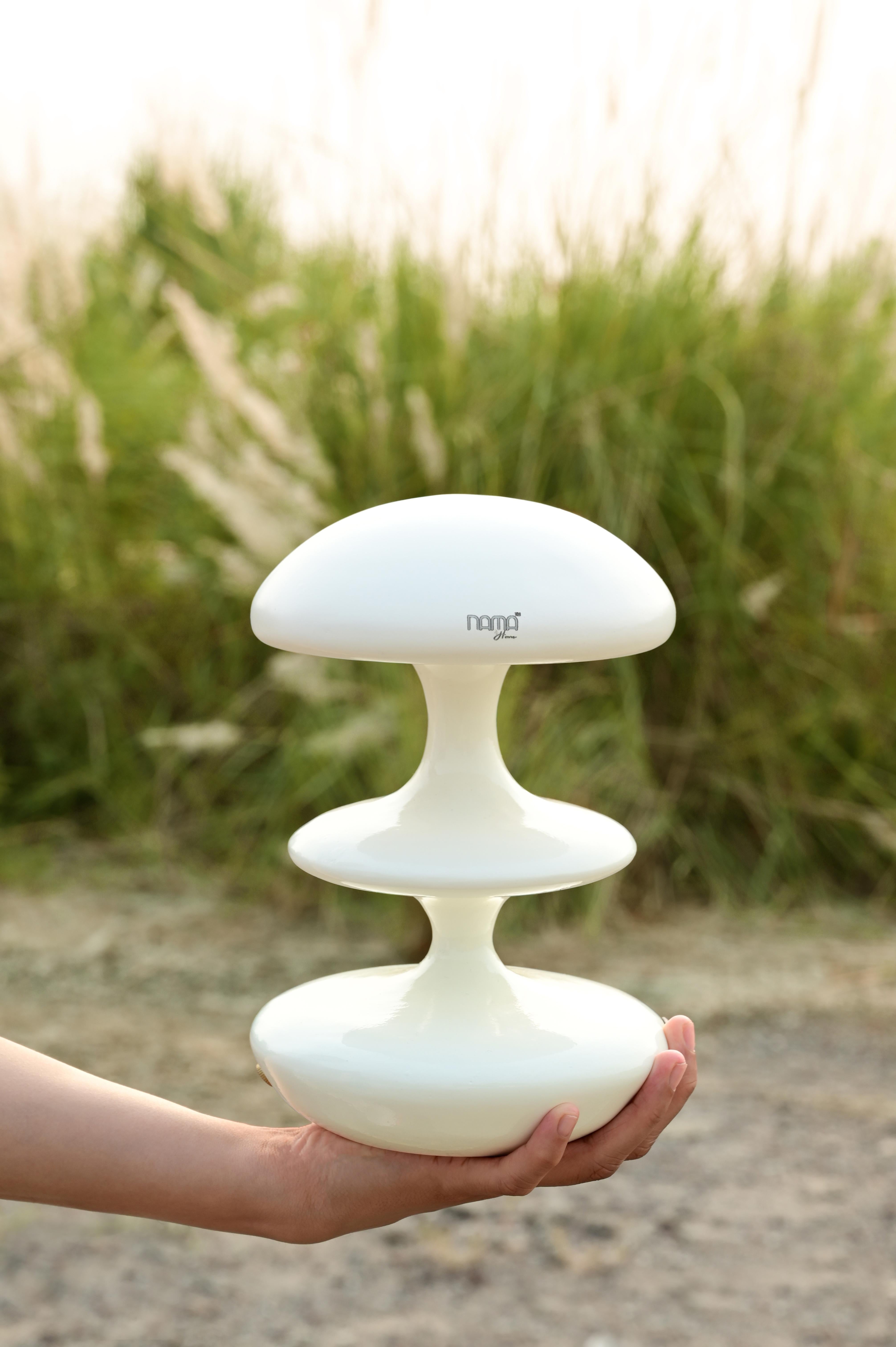 Introducing the Atom Table Lamp – inspired by the cloud that forms after an atom explosion, this lamp's silhouette exudes a bold yet refined blend of sophistication and charm

Crafted from premium materials and available in five versatile colors,