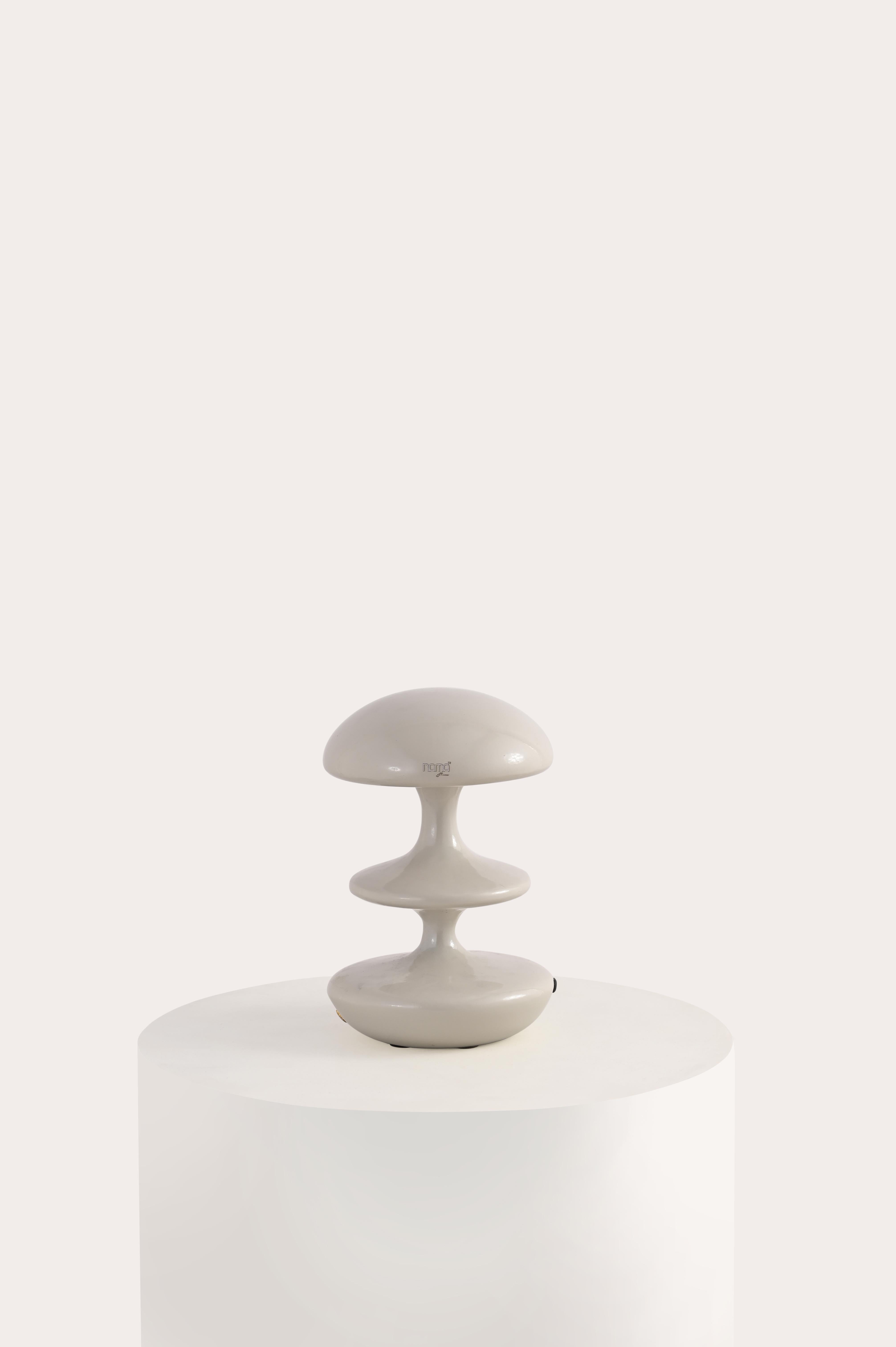 Introducing the Atom Table Lamp – inspired by the cloud that forms after an atom explosion, this lamp's silhouette exudes a bold yet refined blend of sophistication and charm

Crafted from premium materials and available in five versatile colors,