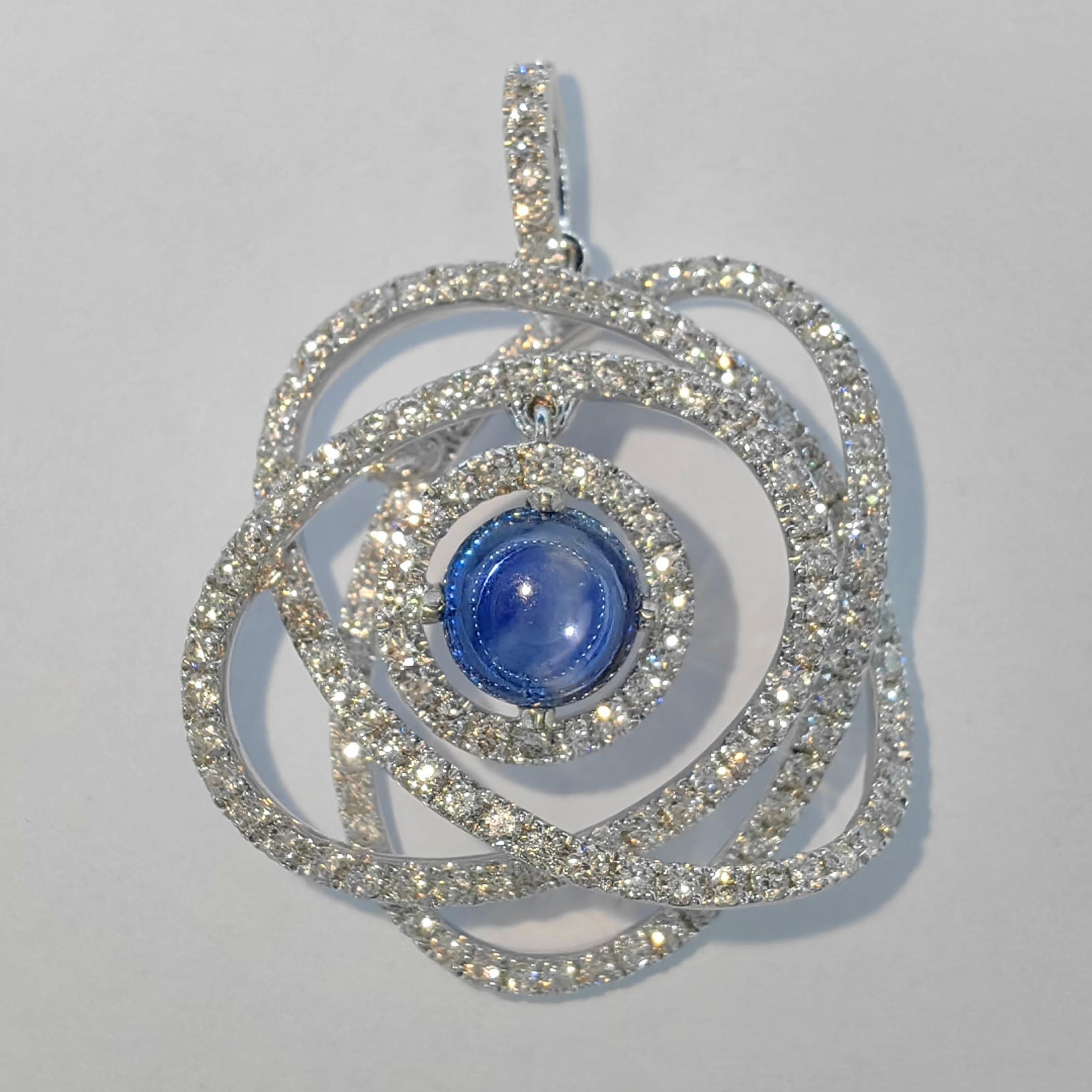 Introducing our remarkable Atom/Whirling Galaxy Cabochon Blue Sapphire Diamond Pendant, a captivating fusion of science and artistry. This pendant draws inspiration from the mysterious realms of the universe, presenting itself as a mesmerizing