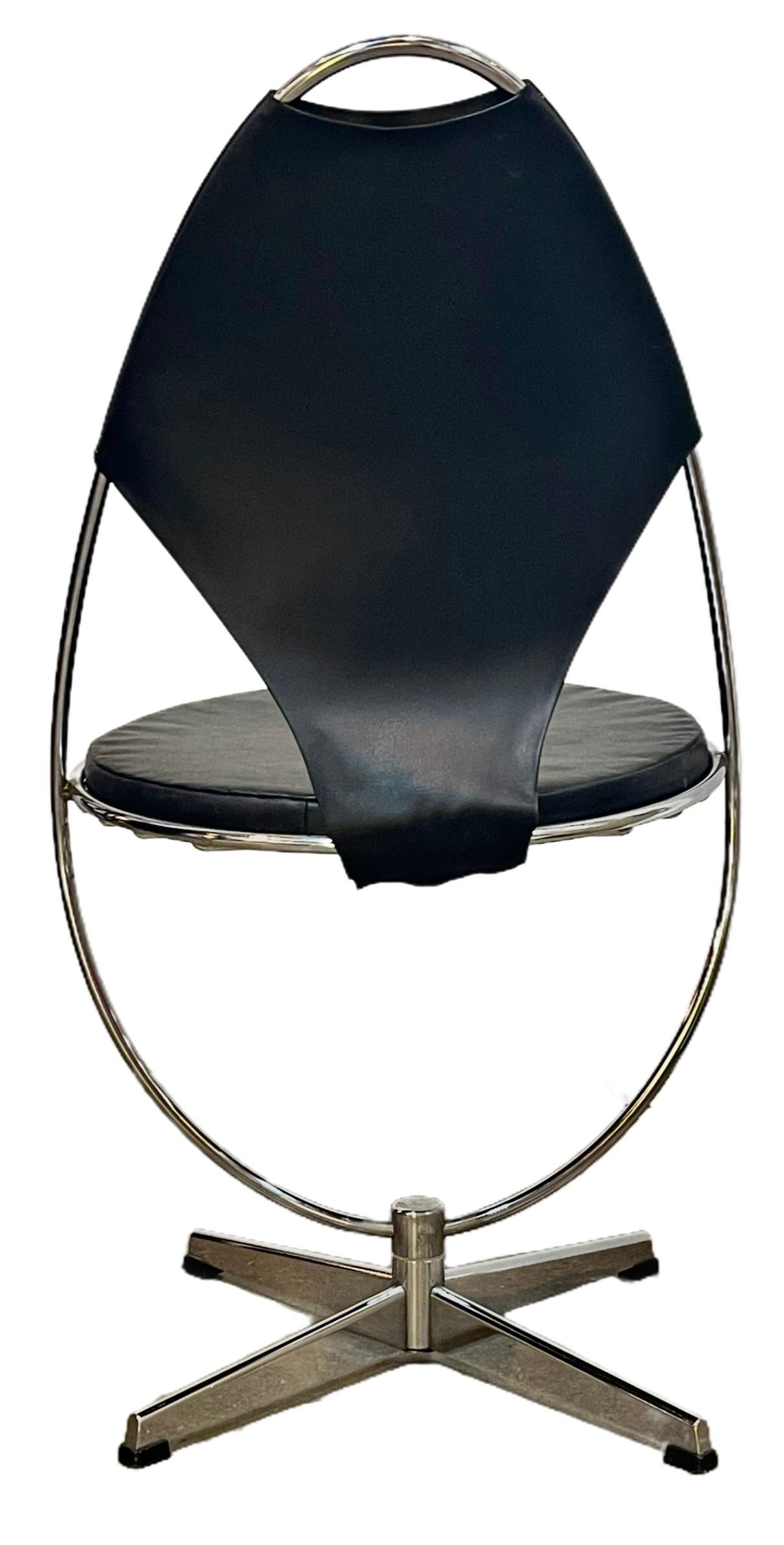 An Atomic Age Swedish chrome swivel chair with curved base and seat back and detachable round vinyl cushion seat.

Sits on a four legged metal base, Designed by Dahlens Dalum in Sweden in the 1950s, this chair shows the range of creativity in
