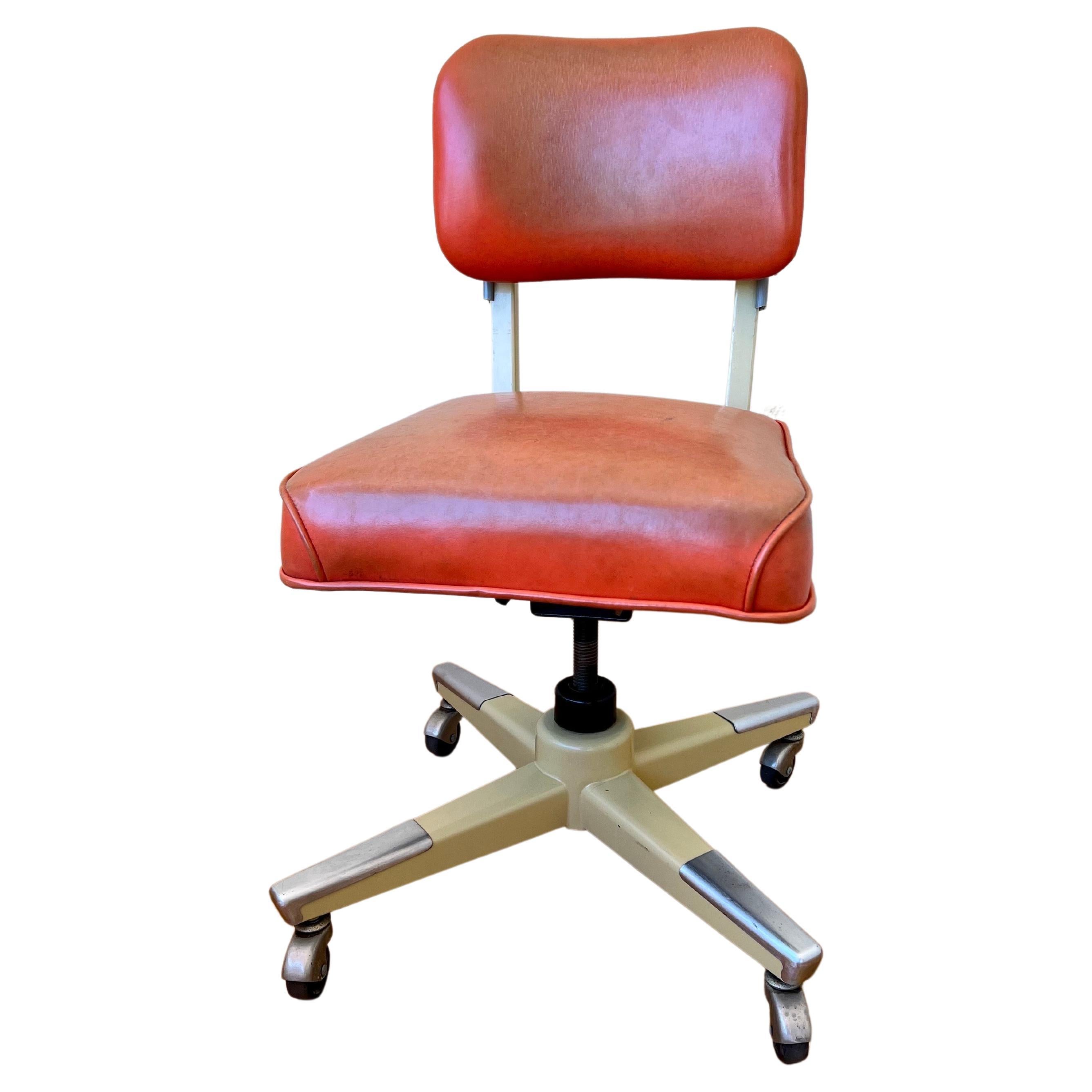 A classic American Office chair in original Naugahyde with steel frame swivels moves up and down, the backrest moves back and forward, a very nice and clean condition we cleaned the seat looks nice clean with original patina.