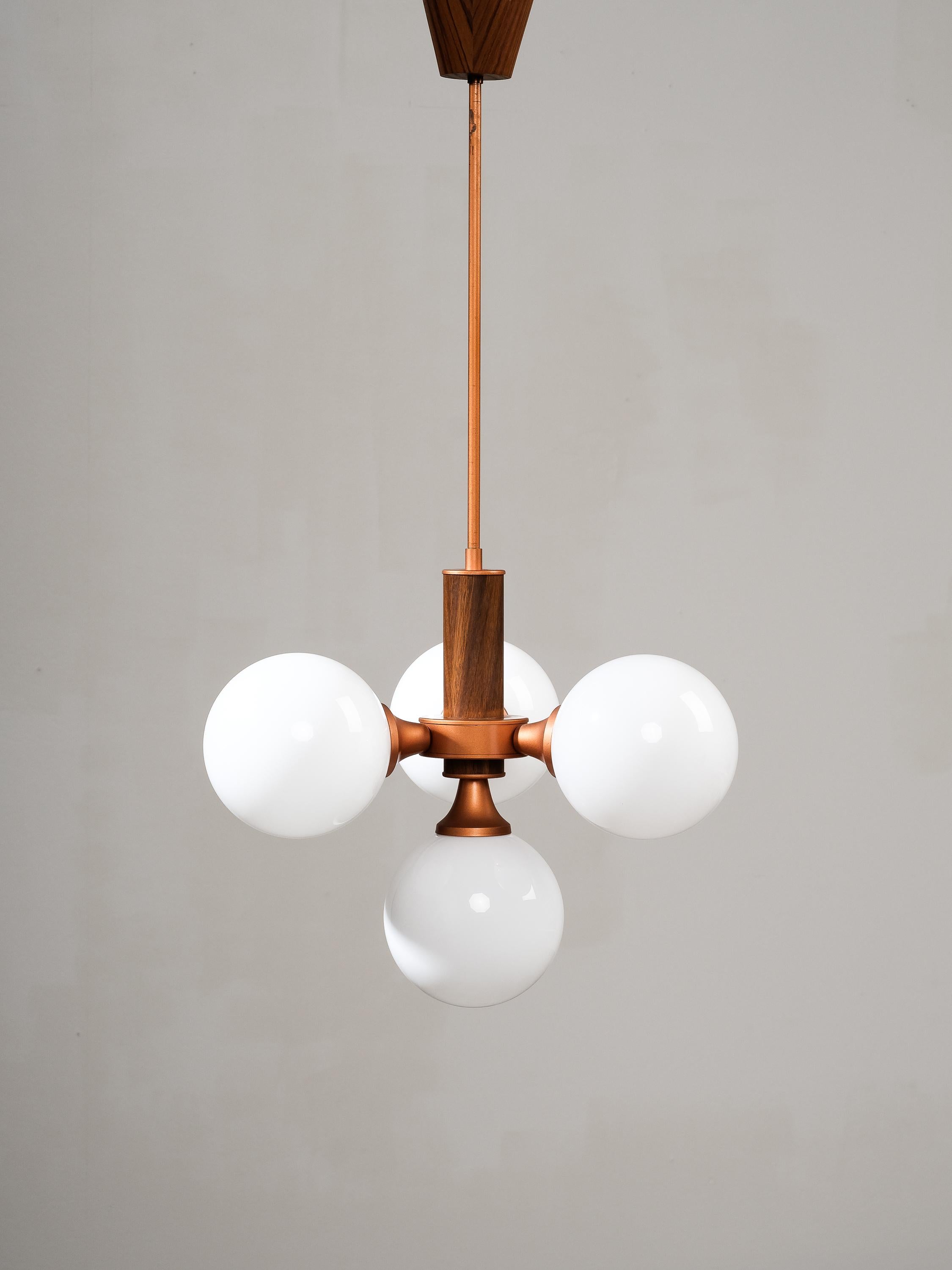 Rare space age/sputnik style ceiling light model 2651/4 by Finnish light manufacturer Valinte, 1970s. Teak veneer detailing and copper paint metal parts.