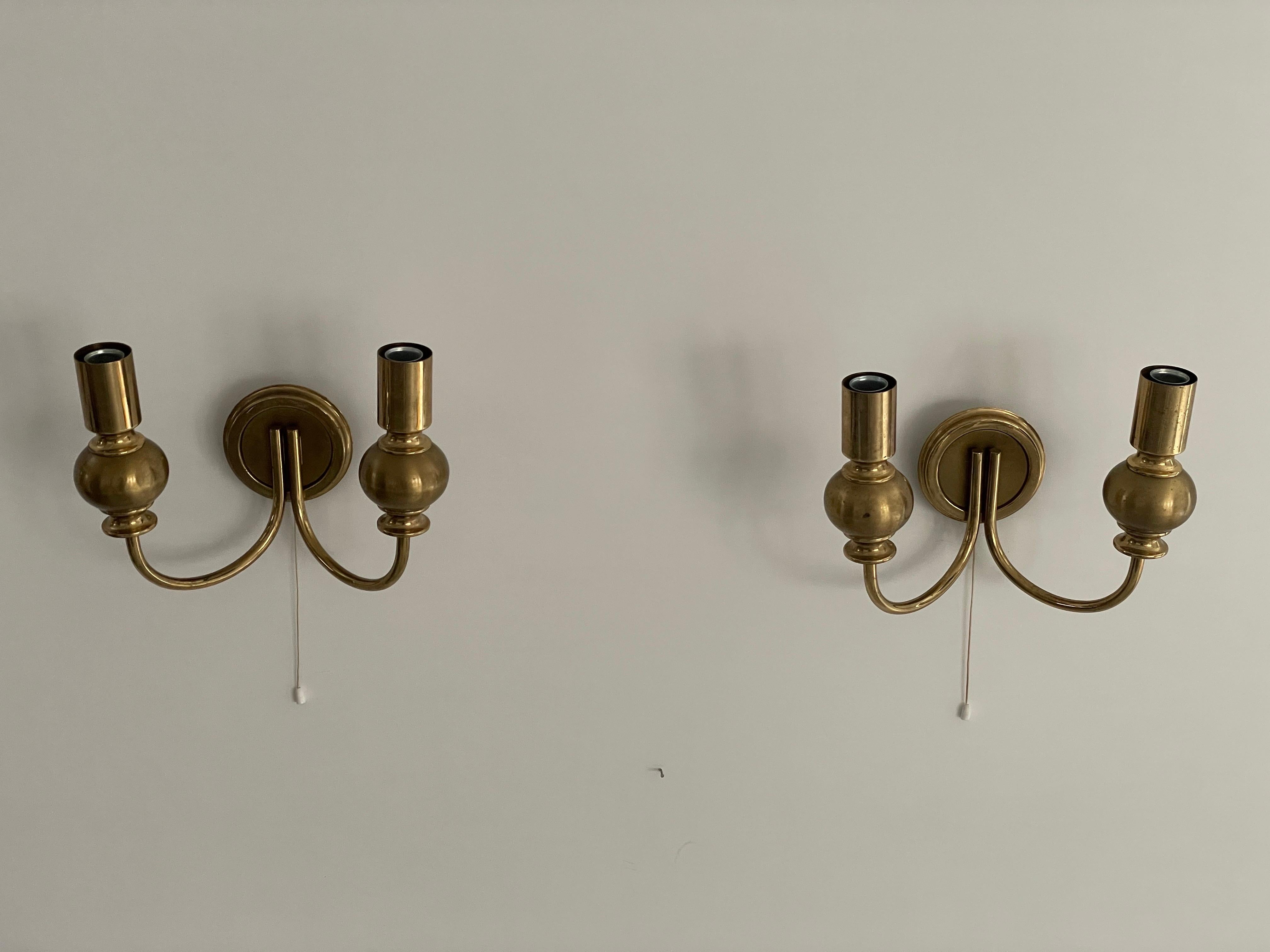 Atomic Design Brass Pair of Sconces by N Leuchten, 1950s, Germany

Lampshade is in very good vintage condition.

This lamp works with  2x E14 light bulbs. 
Wired and suitable to use with 220V and 110V for all countries.

Measurements:
Height: 20