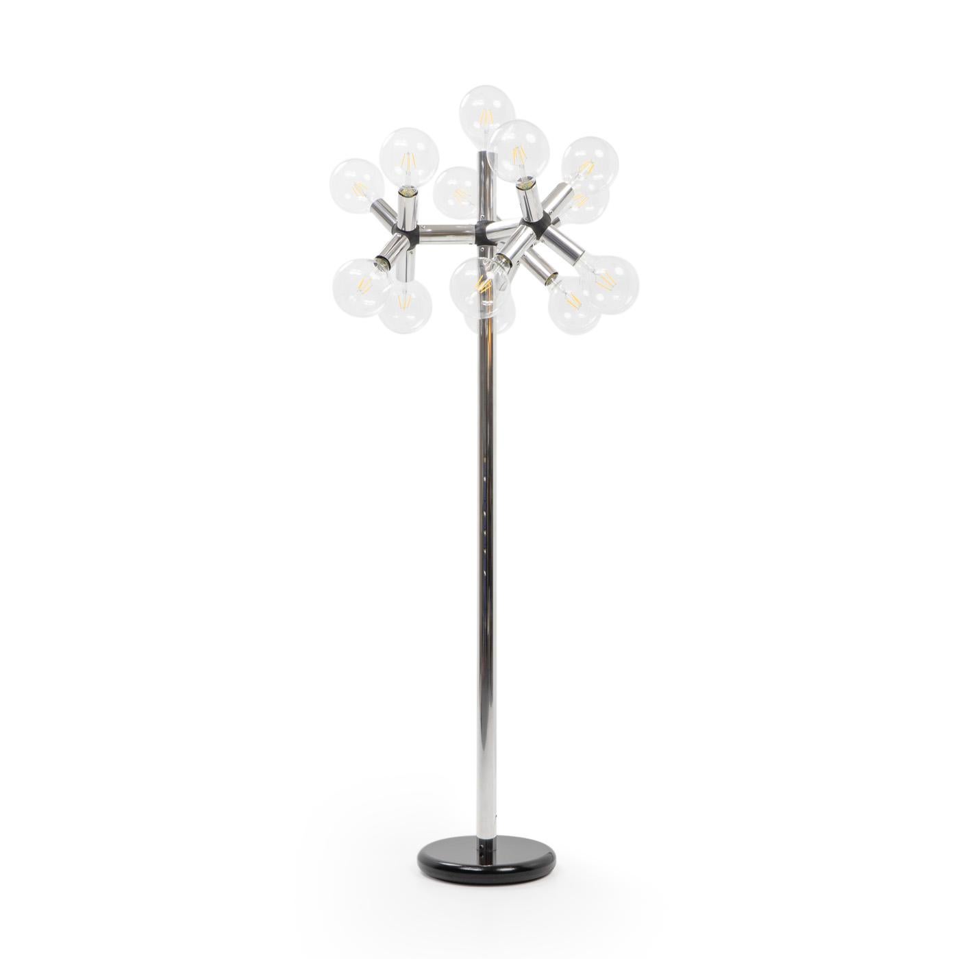 Aluminum “Atomic” Floorlamp designed by Trix and Robert Haussmann in the 1960s, and produced by Swisslamps International.

The lamp is made of aluminum and connecting plastic tubes, and features 13 individual 125mm globe lightbulbs