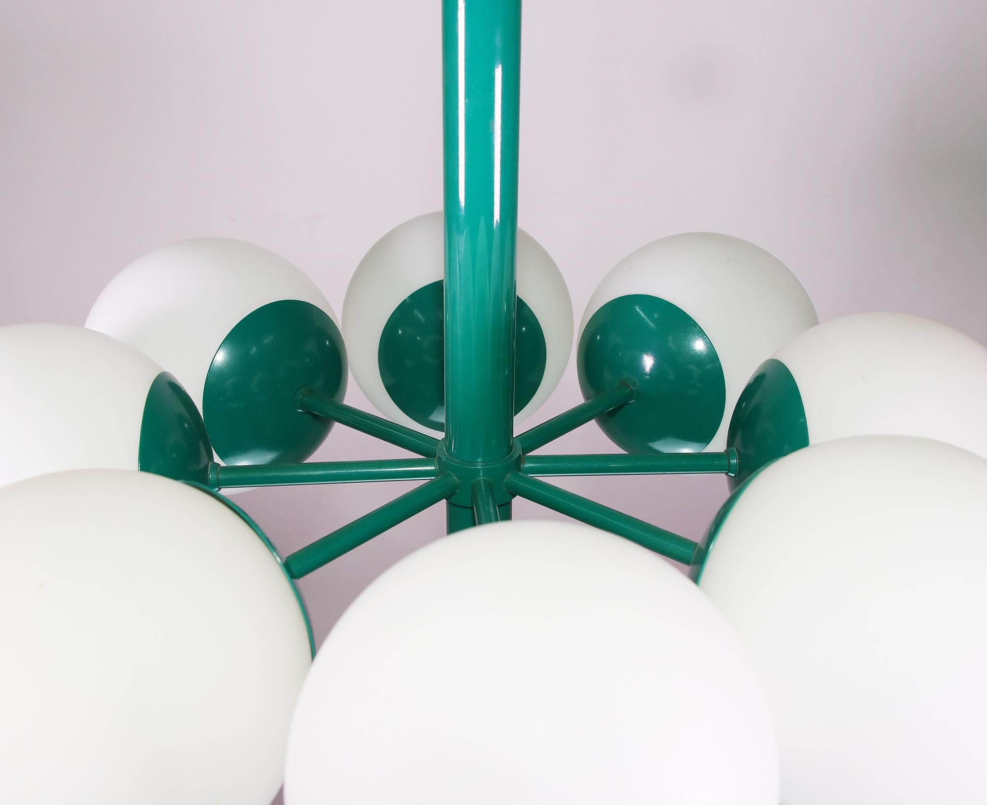 Kaiser atomic chandelier with eight white opal glass balls on an green metal frame, made by Kaiser Leuchten in Germany in the 1960s.
Very good condition with all original components.
European wiring with eight small Edison bulbs E14 and fabric