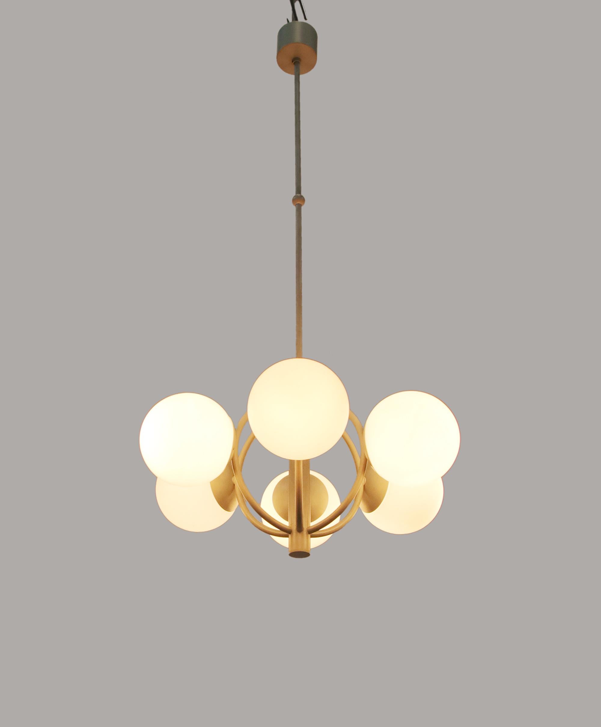 This gorgeous Mid-Century Modernist chandelier with 6 handcrafted double layer opal glass globes on a white enameled brass frame. Designed and manufactured by Kaiser Lighting, Germany in the 1970s. 
 
Model: Satellite, Sputnik. 
Style: Mid-Century