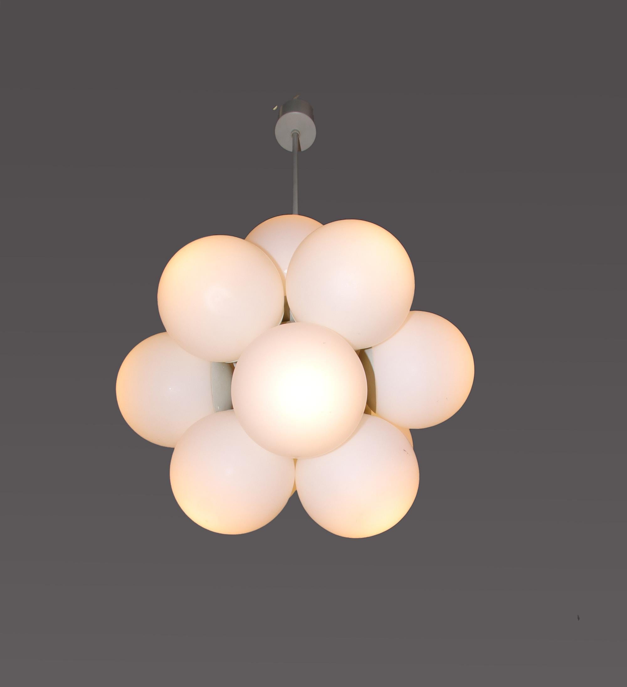 This gorgeous Mid-Century Modernist chandelier with 12 handcrafted double layer opal glass globes on a white enameled brass frame. Designed and manufactured by Kaiser Lighting, Germany in the 1970s. 

Model: Atomic, Sputnik. 
Style: Mid-Century