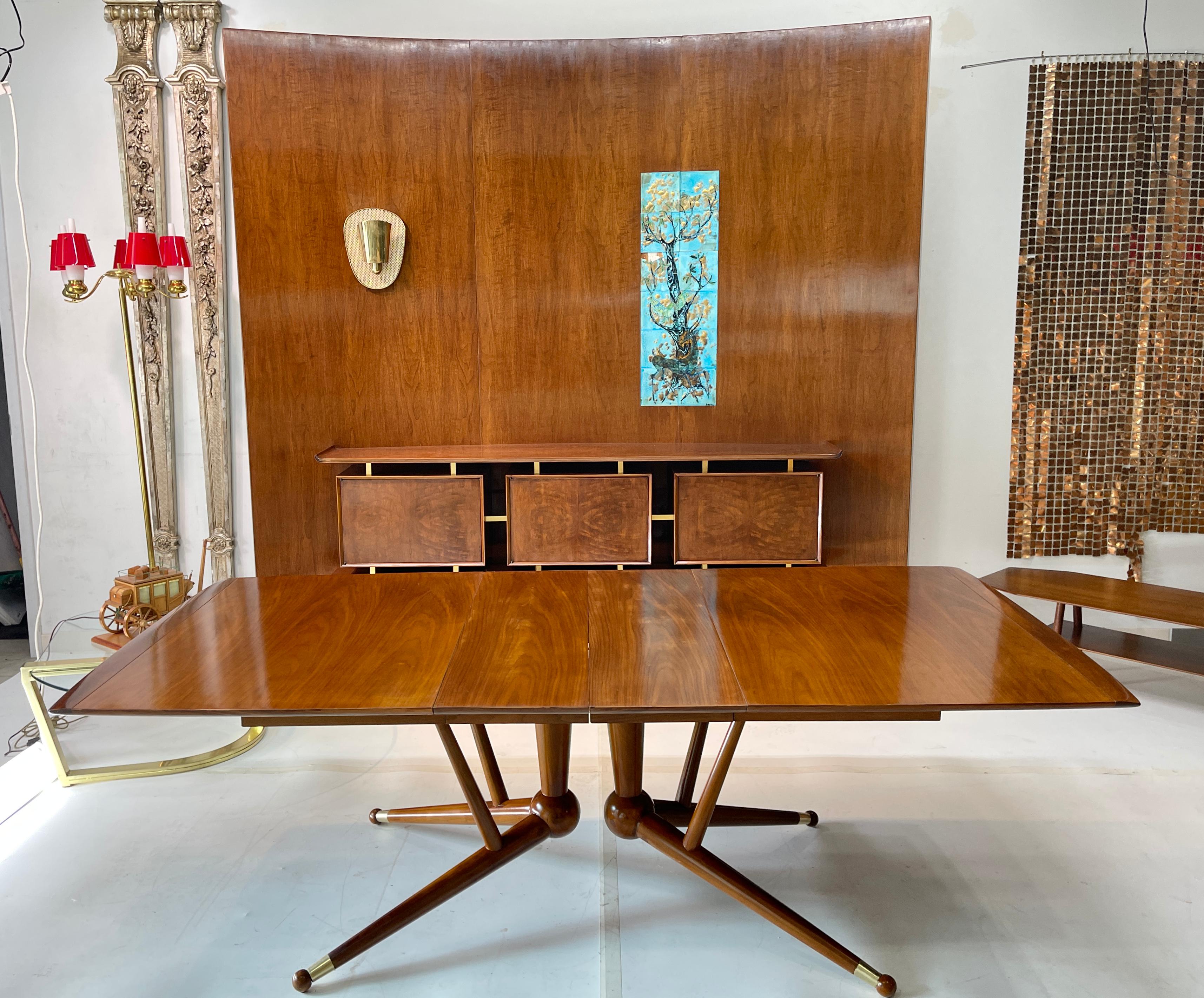 American Mid-Century Modern expandable dining table with extraordinary base which appears to defy gravity. I need my 10th grade geometry teacher to explain the theorem behind this amazingly sculptural structure which resembles a tetrahedral