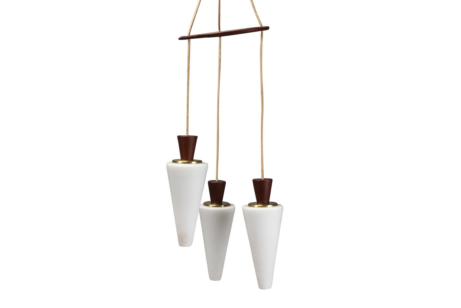 Mid-Century Modern Atomic Tri-Pendant Lamp In Teak With Frosted Glass Cones For Sale