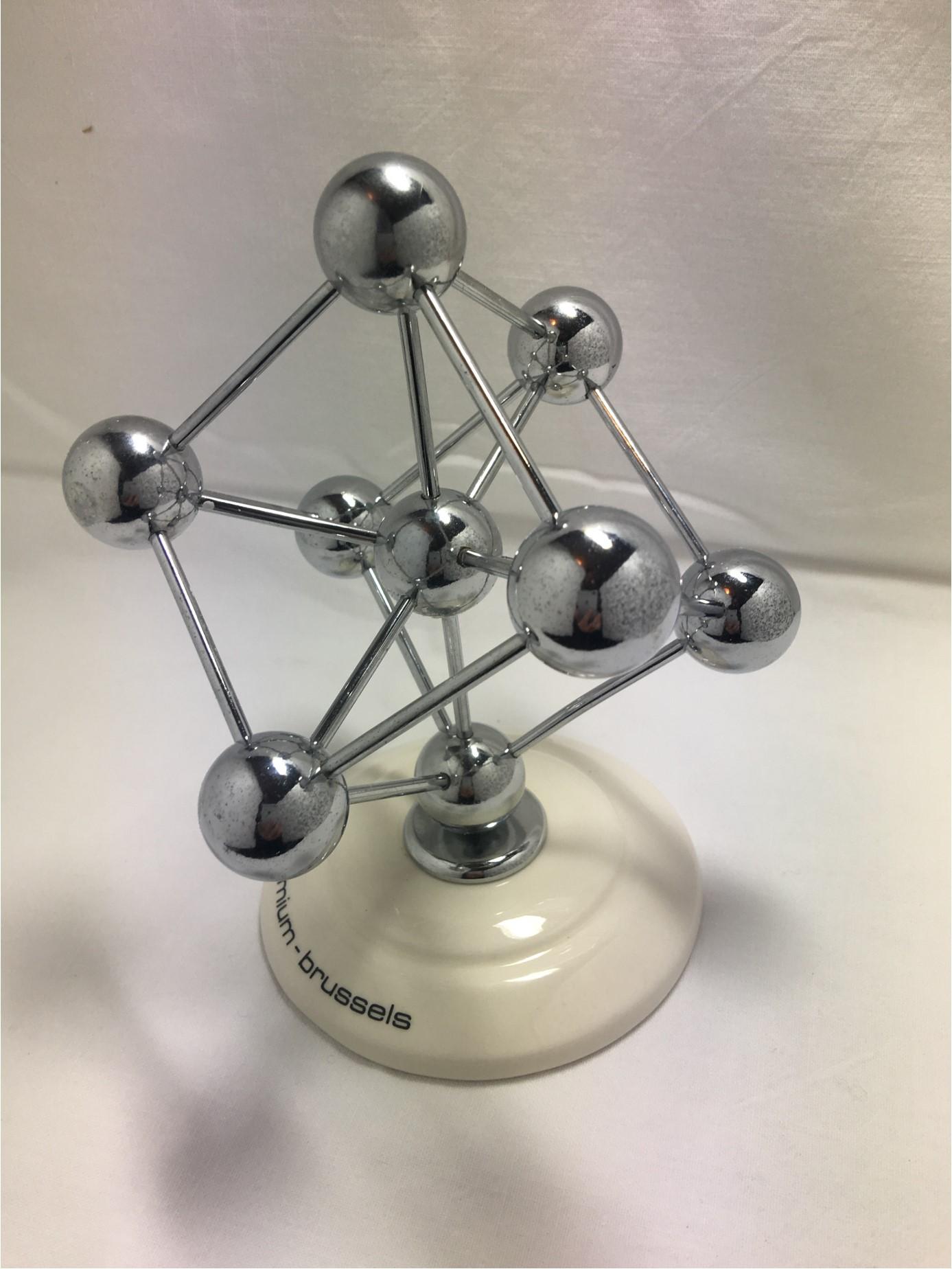 A lovely desk decoration from Brussels. The Atomium was built as the main pavilion and icon of the 1958 World's Fair of Brussels (Expo 58). In the 1950's, faith in scientific progress was great, and a structure depicting atoms was chosen to embody