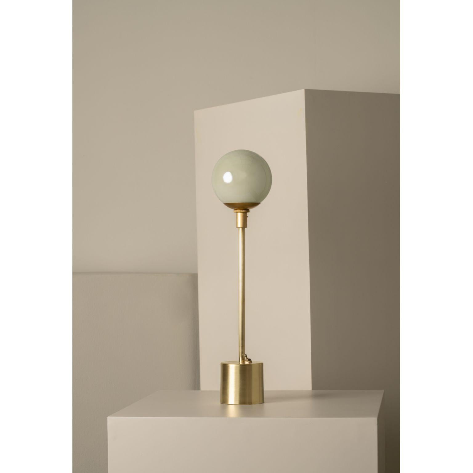 Átomo White Blown Glass and Brass Table Lamp by Isabel Moncada
Dimensions: Ø 13 x H 33 cm.
Materials: Brass, steel and blown glass.

Átomo is perfect to give a touch of silent light, almost like a sparkle. The simplicity of its globe is enough, a