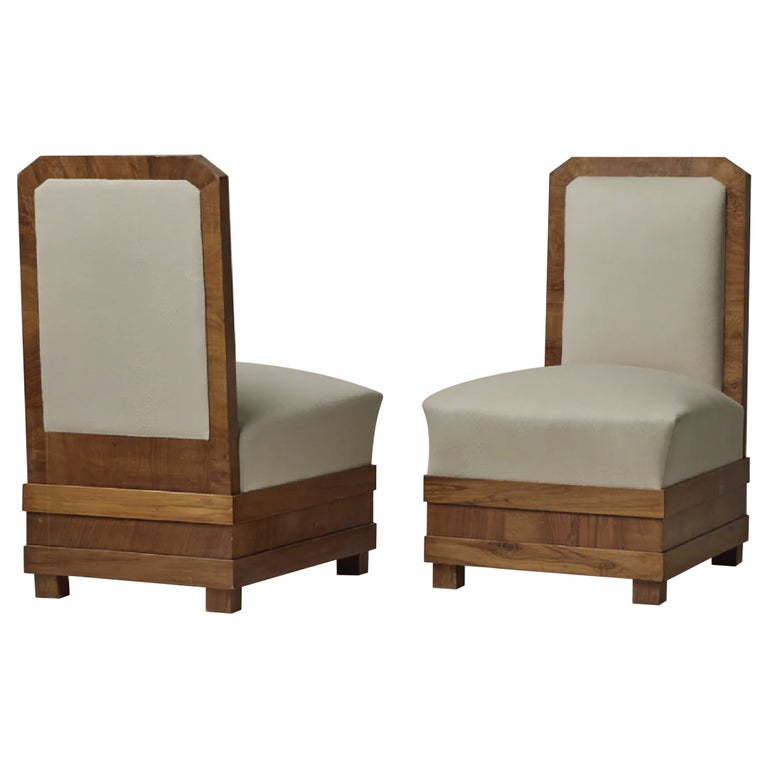 True heritage pieces, this pair of centarian Art Deco Slipper Chairs are pure in their geometric form. Previously pre-loved and a meld of new inspiration and aged character, these maple veneer chairs are vintage condition with new