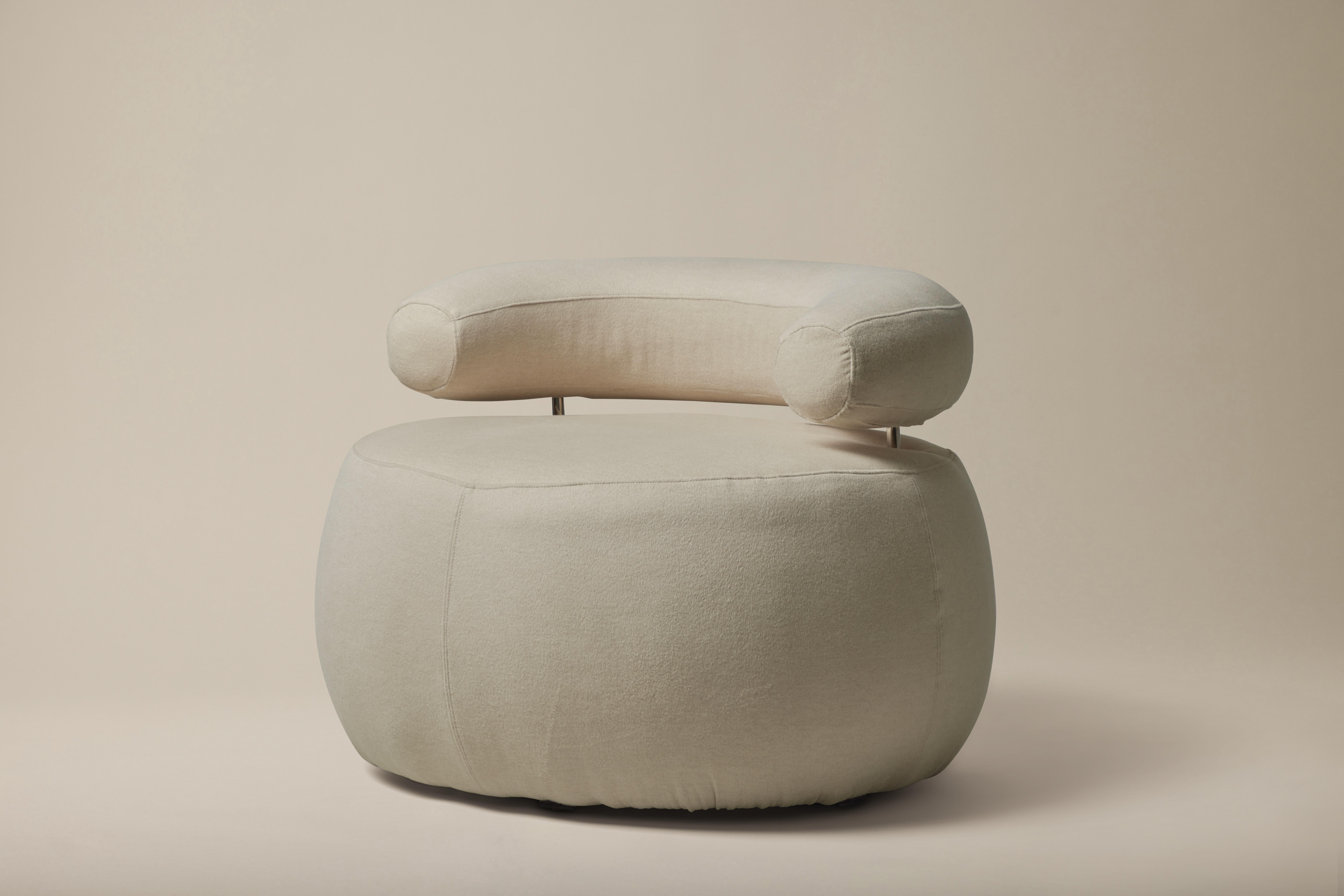 Expansively versatile, this vintage Roche Bobois Style Pouf Lounge Chair is newly reupholstered in a cream cashmere. The curved back support is accented with nickel hardware. 

Additional Information:
Material: Cashmere, metal
Dimensions: 36 W x