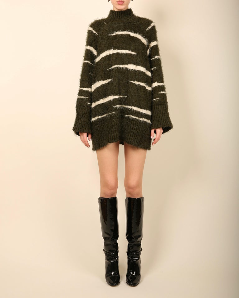 The Attico oversized sweater dress 
Dark green with white stripe print
Mock turtle neck

Size:
Small with plenty of stretch - please note that this dress is cut to fit oversized, it will therefore work for several sizes ranging from a