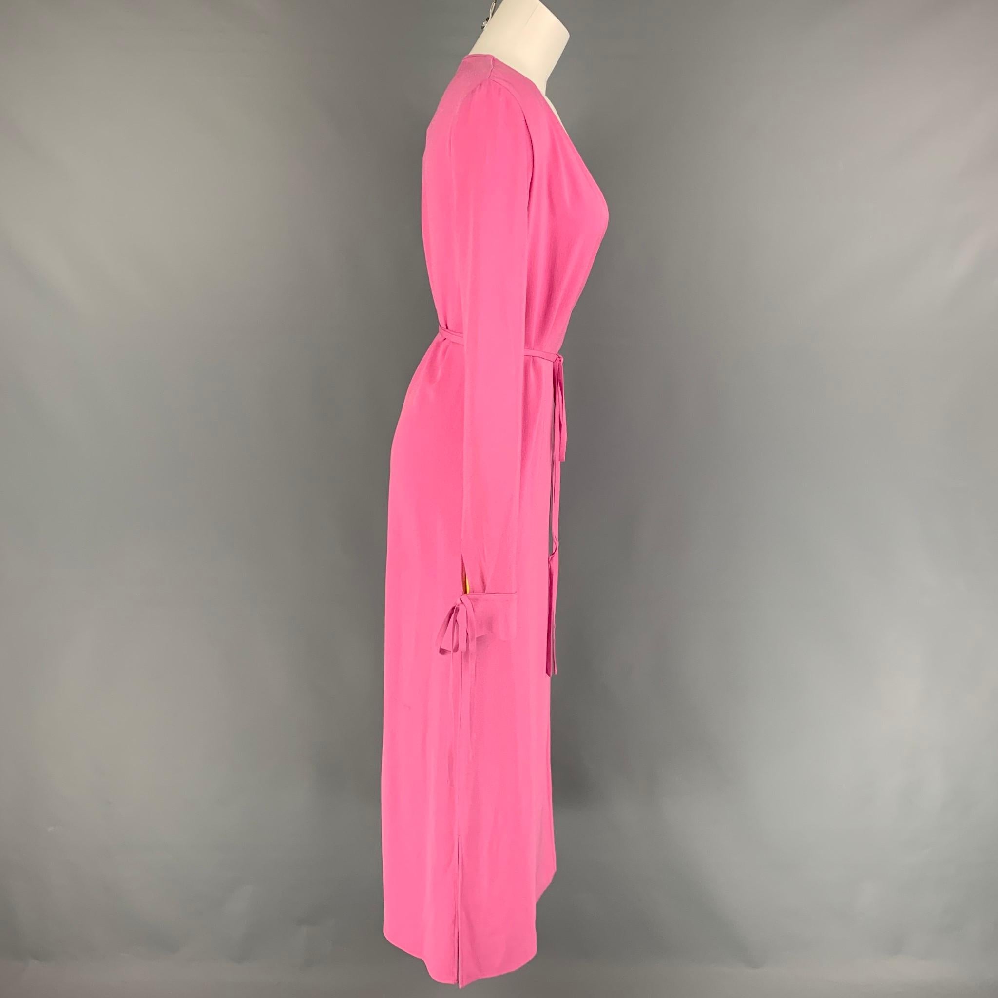 ATTICO dress comes in a pink acetate / viscose featuring a wrap style, sleeve strap details, slit pockets, side slits, and a back self tie strap closure. Made in Italy. 

New With Tags. 
Marked: 36

Measurements:

Shoulder: 15 in.
Bust: 36
