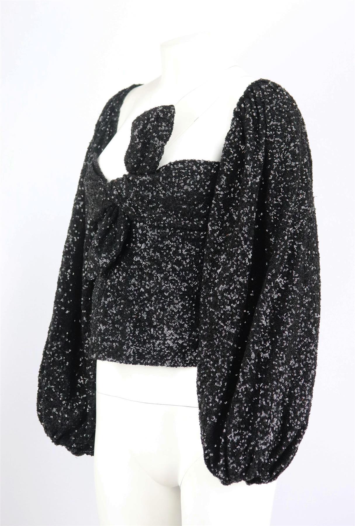 This top by The Attico takes cue from exaggerated '80s silhouettes and textures, it’s made from inky crepe covered with scores of black sequins, it's cut for a close fit with oversized balloon sleeves and a twisted sweetheart neckline. Black crepe.