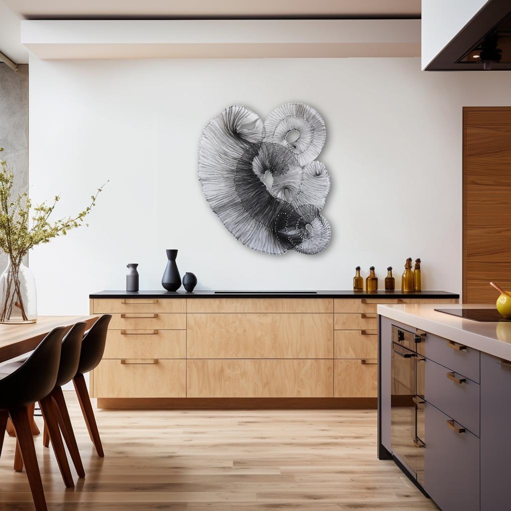 Atticus Adams' organically composed modern metal sculptures embody the transformative power of art, illustrating the creation of beauty, meaning, and emotional impact from industrial materials. Using mostly aluminum mesh—generally found in screen