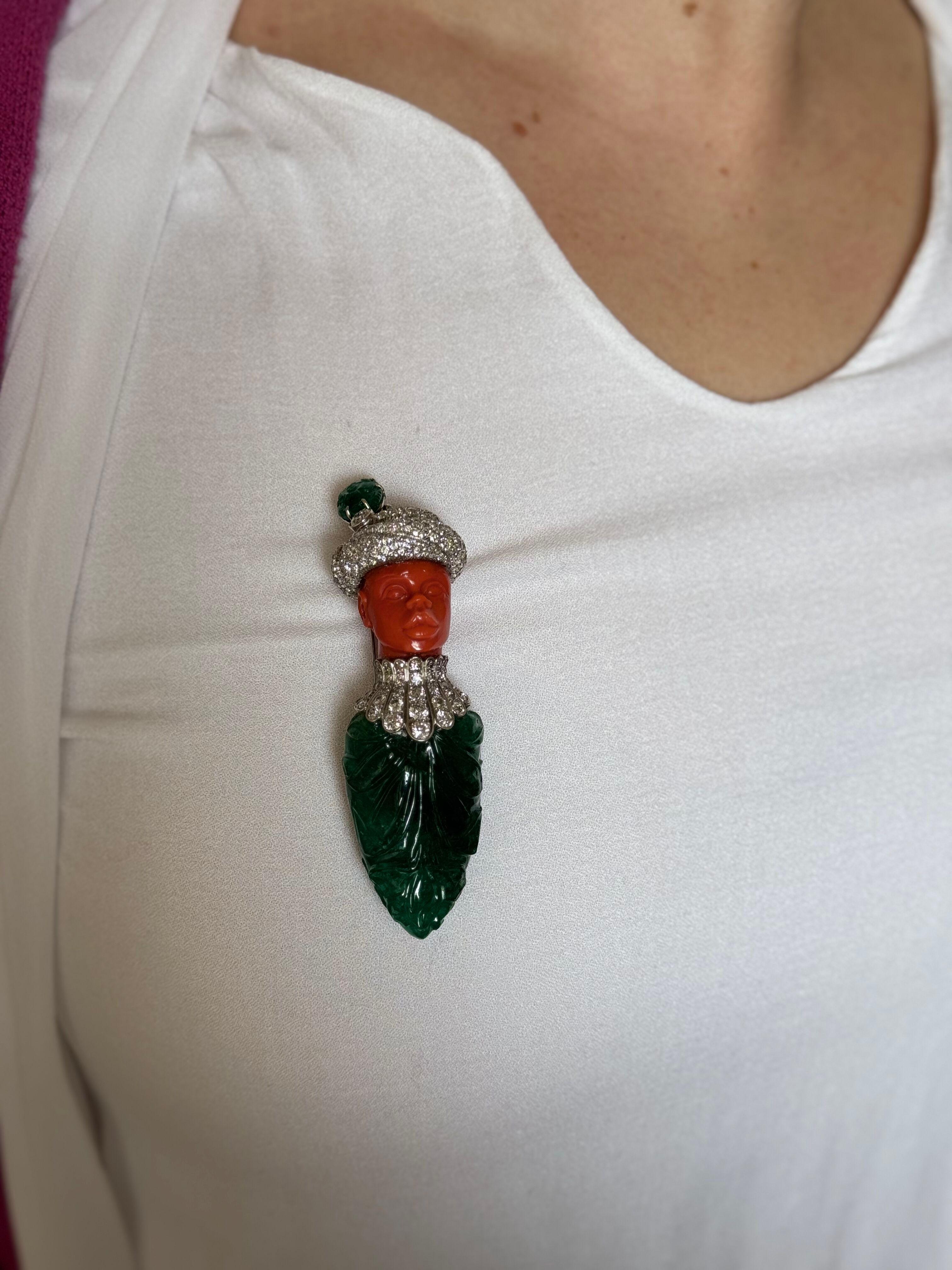 Unique and one of a kind Attilio Codognato 18k white gold brooch, featuring an approx. 200+ in carved emerald, carved coral and approx. 4ctw G-H/VS diamonds.
Brooch measures 3.5