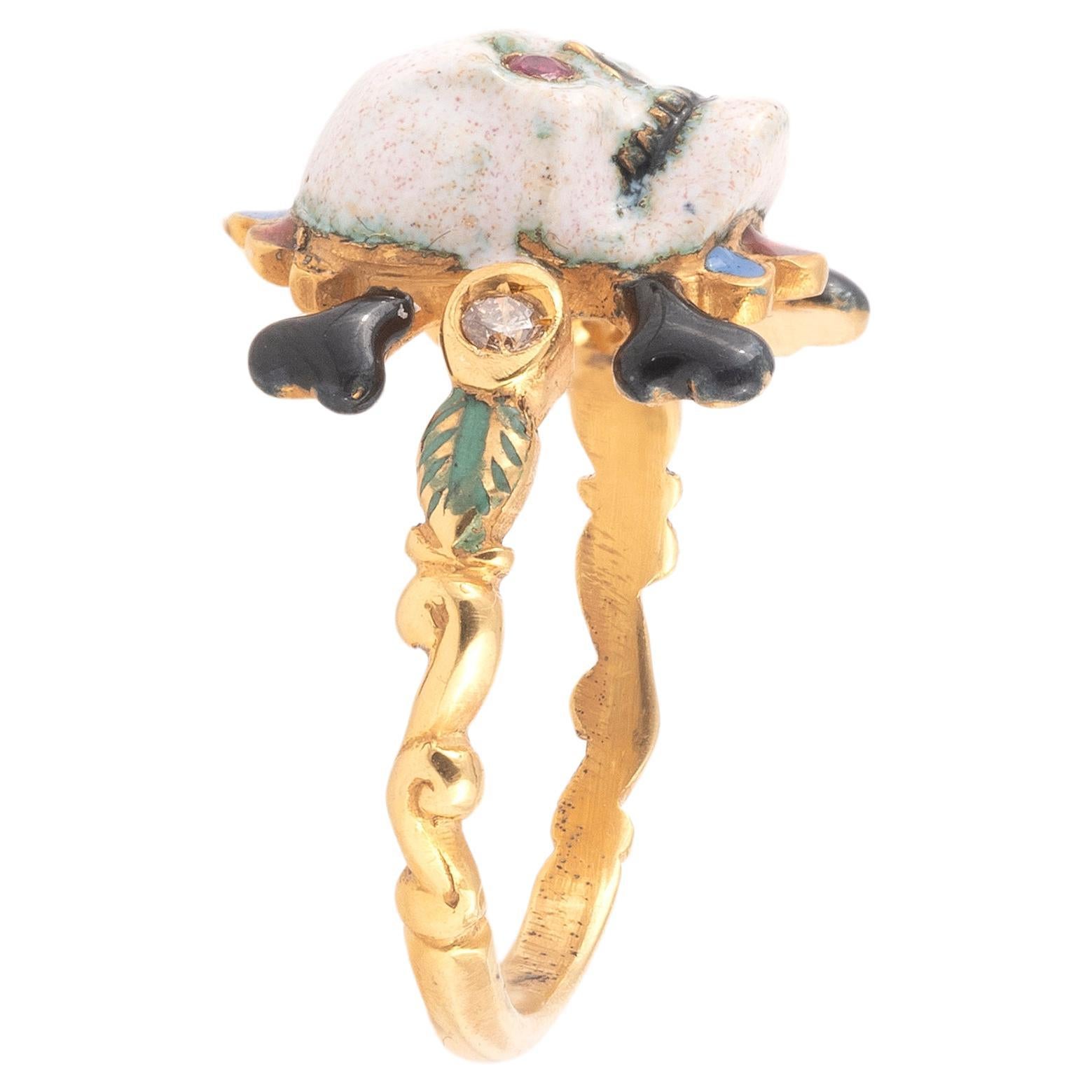 Renaissance style Memento Mori skull ring made with champleve multicolored enamels and rubies eyes.
Mounted in 18Kt gold
Signed A. Codognato
Weight: 5.8 gr
Finger size: 7

