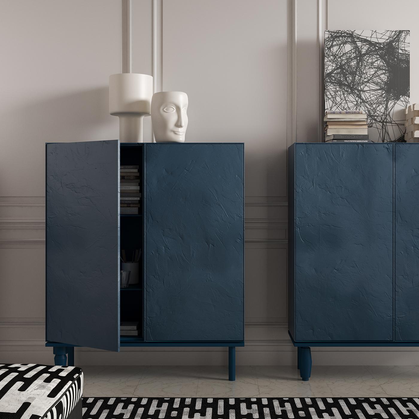 A dash of color and versatile storage space distinguish this elegant cabinet part of a modular series with different finishing options. MDF panels make this piece that boasts an internal and external finish in matte lacquer and a playful detail in