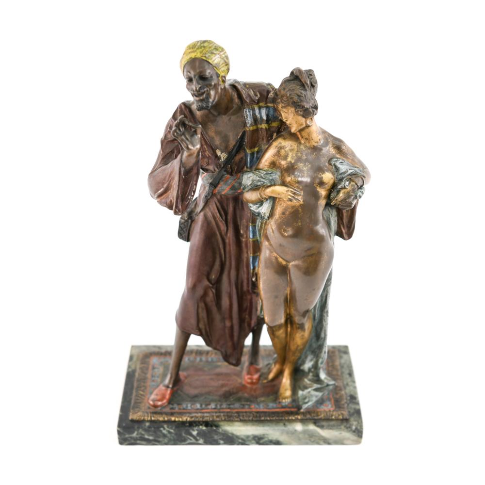 A fabulous Austrian cold painted bronze figure entitled ‘Arab Slave Trader’ attributed to Franz Bergmann, of an Arab merchant plying his wares with excellent color and very fine hand finished detail.