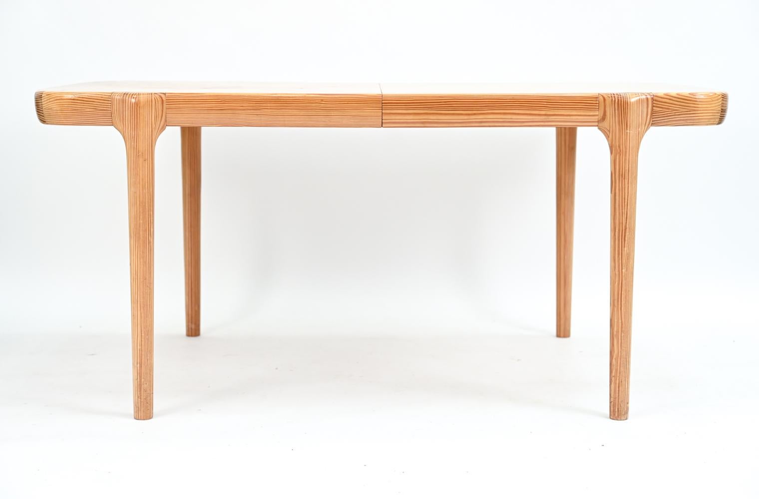 An unusual Danish mid-century dining table in pine, attributed to Niels O. Moller. No apparent manufacturer's labels present. This impressive table includes two 20.5