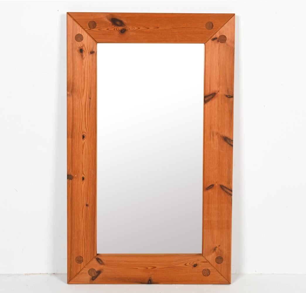 Unveil a timeless treasure of Scandinavian design with this exquisite mirror, attributed to the renowned Roland Wilhelmsson. Rooted deeply in the mid-century ethos, this piece encapsulates the very essence of Swedish elegance—simple, yet profoundly