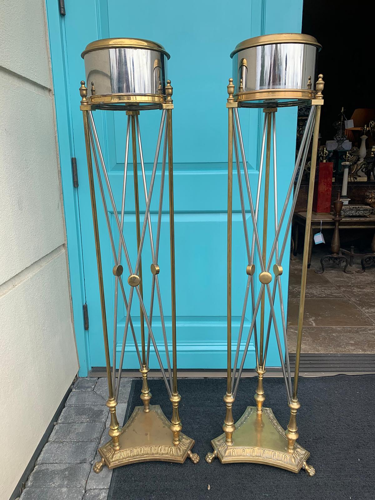 Attributed to Maison Jansen pair of steel and brass torchères or plant stands, circa 1960s.
 