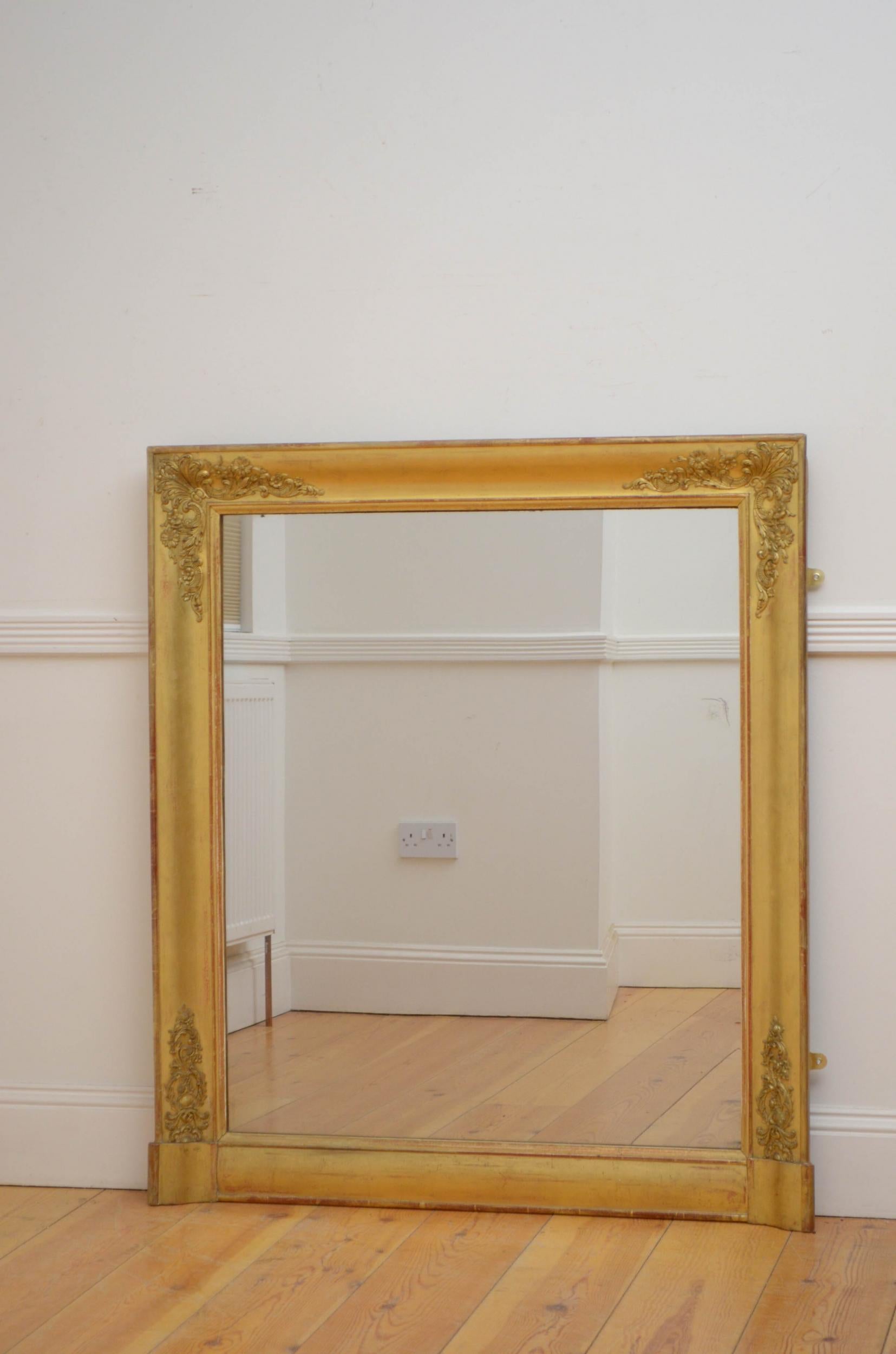 Sn5103 attractive French gilded wall mirror, having original glass with some foxing in moulded and gilded frame with foliage decoration to the corners. This antique mirror retains its original glass, original gilt and original backboards, all in