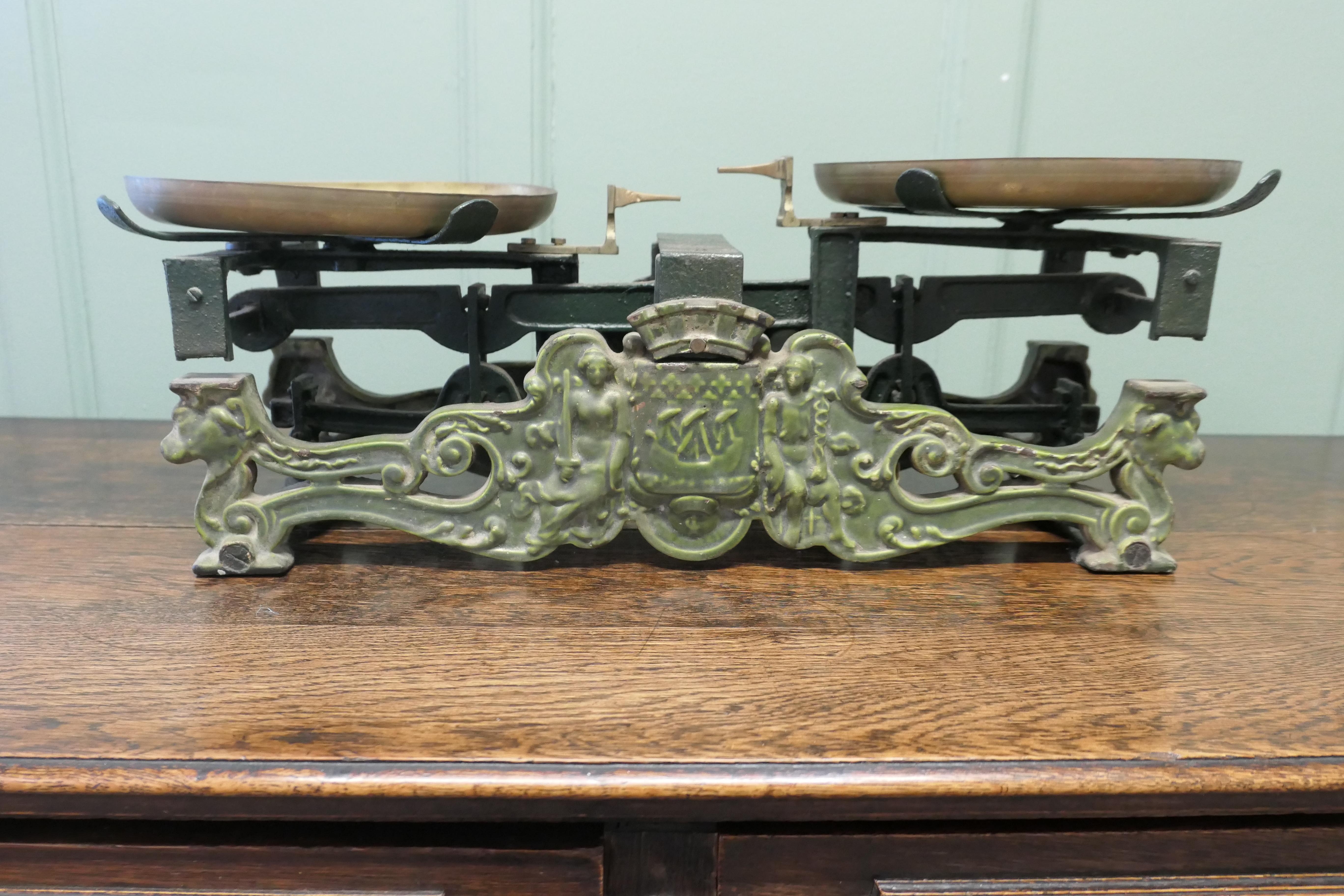 Attractive 19th Century French Grocer’s Balance Scales
The scale has 2 brass pans, the body of the scale is very decorative in green enamel 
The Scale is now mainly a decorative piece and while still working it is worn so we cannot vouch for its