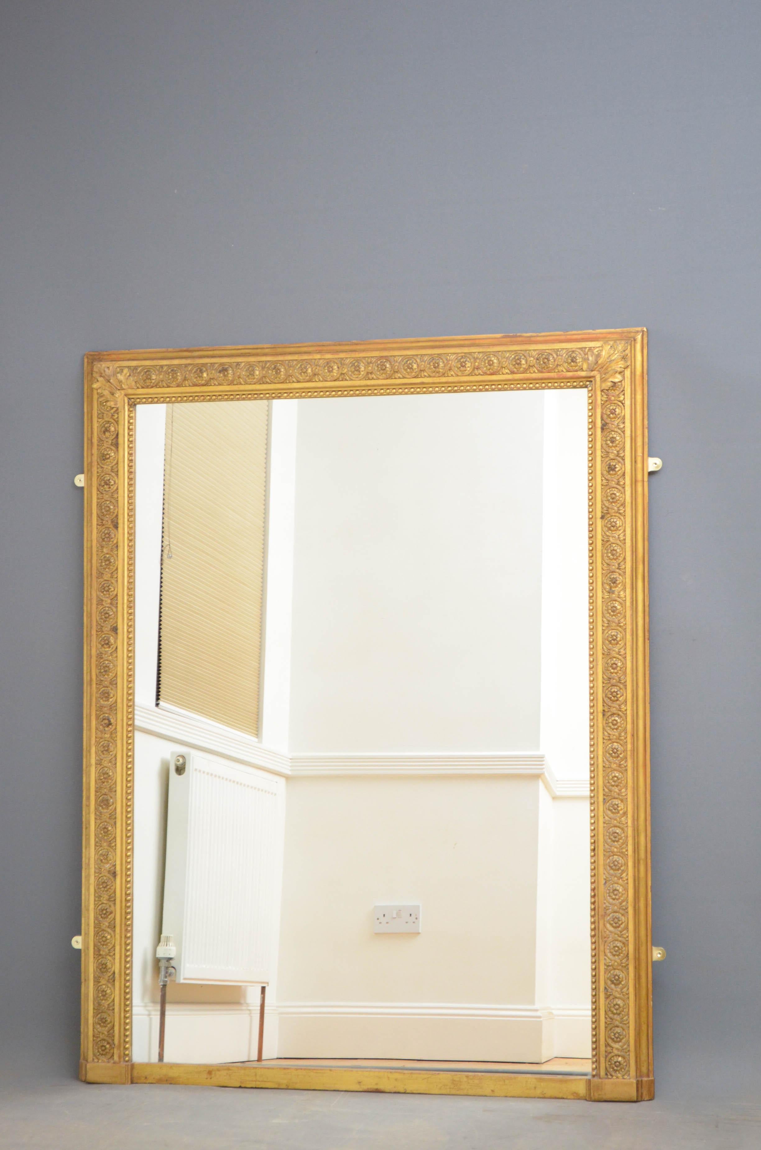 Sn4839, attractive 19th century giltwood mirror, having a replacement glass in good condition in beaded and flower carved frame with moulded edge and acanthus leaf decoration to the top. This antique mirror retain its original gilt and backboards,