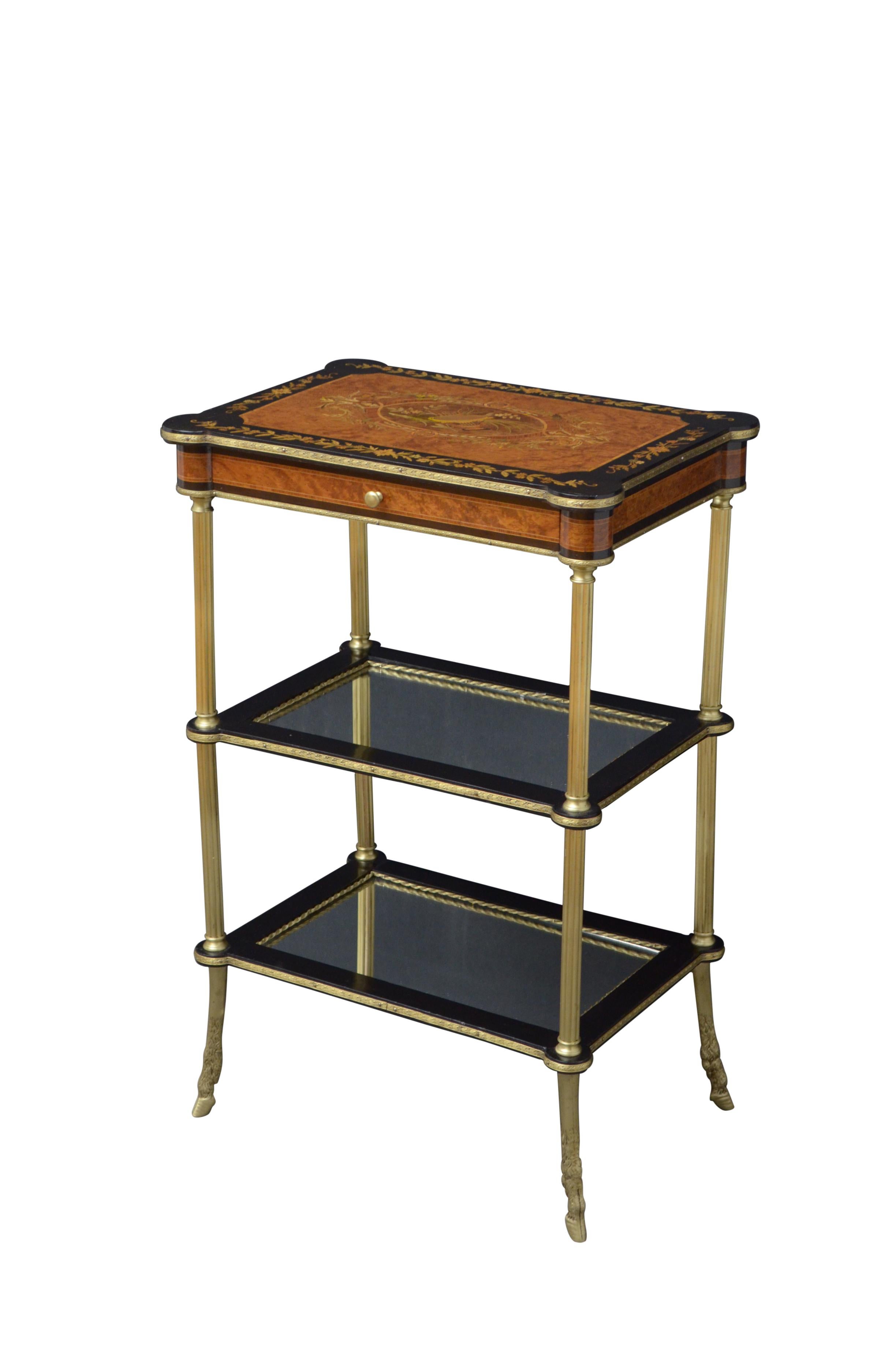 K0454 Attractive French lamp table, finely inlaid top with ebonised edge above mahogany lined drawer and 2 mirrored tiers, raised on brass reeded columns terminating in hoof feet. This antique table is in home ready condition. c1890
Measures: H