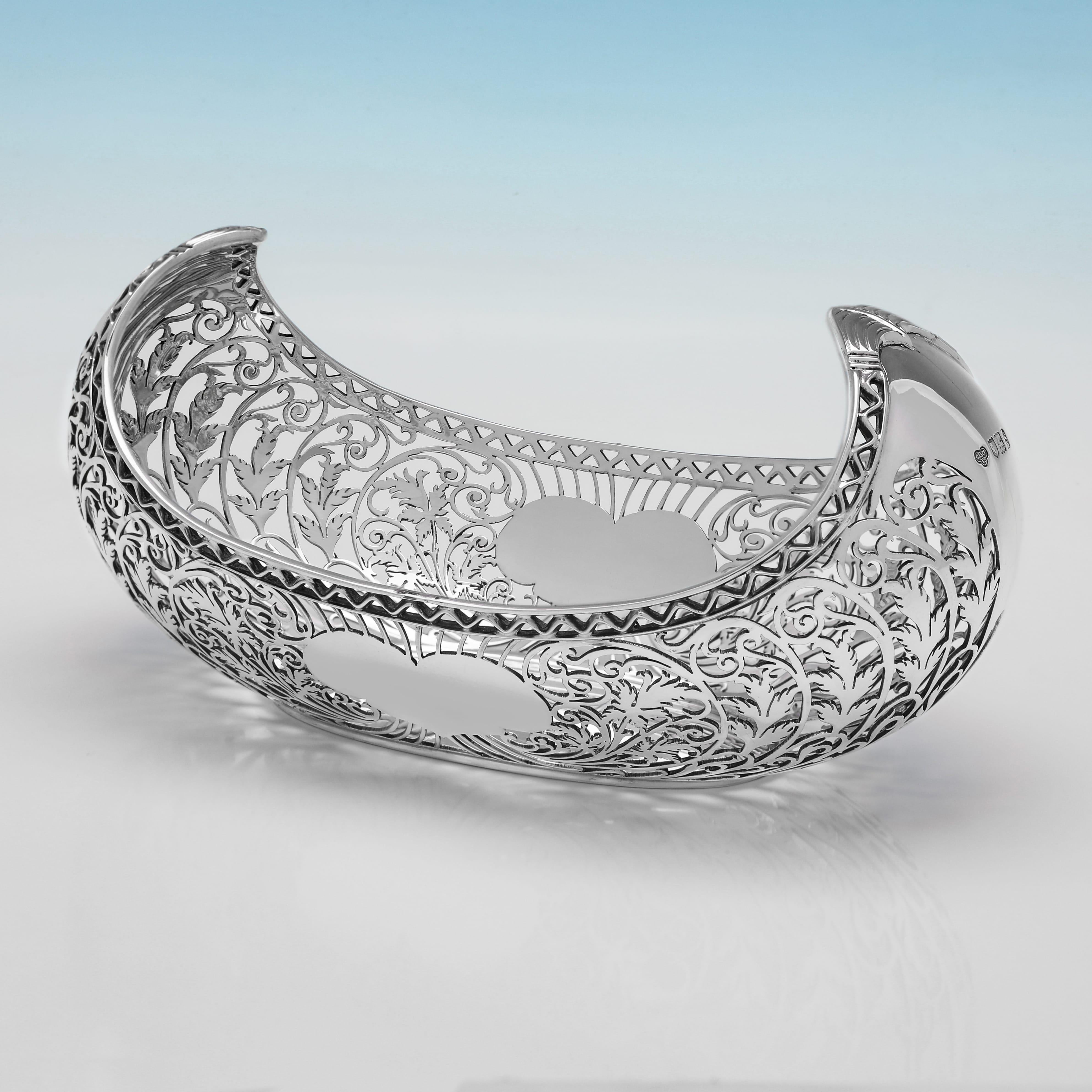 Hallmarked in London in 1913 by Goldsmiths & Silversmiths Co., this this striking, Antique Sterling Silver Dish, features pierced detailing throughout and heart shaped cartouches. The dish measures 4.25