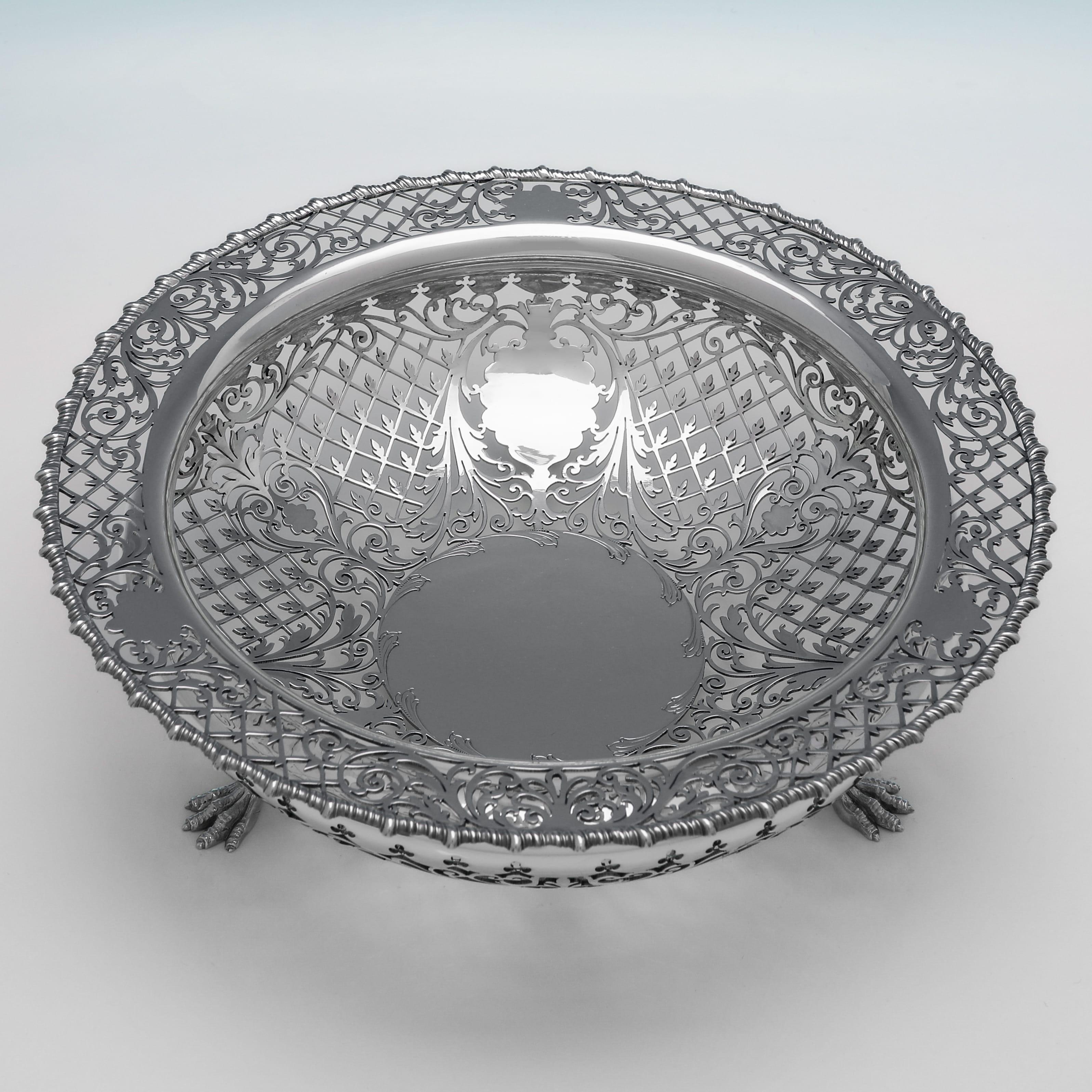 Hallmarked in Sheffield in 1915 by James Dixon & Sons, this attractive, Antique, George V period, Sterling Silver Dish, stands on 3 claw feet, and features pierced decoration to the body and rim. The dish measures 3.25